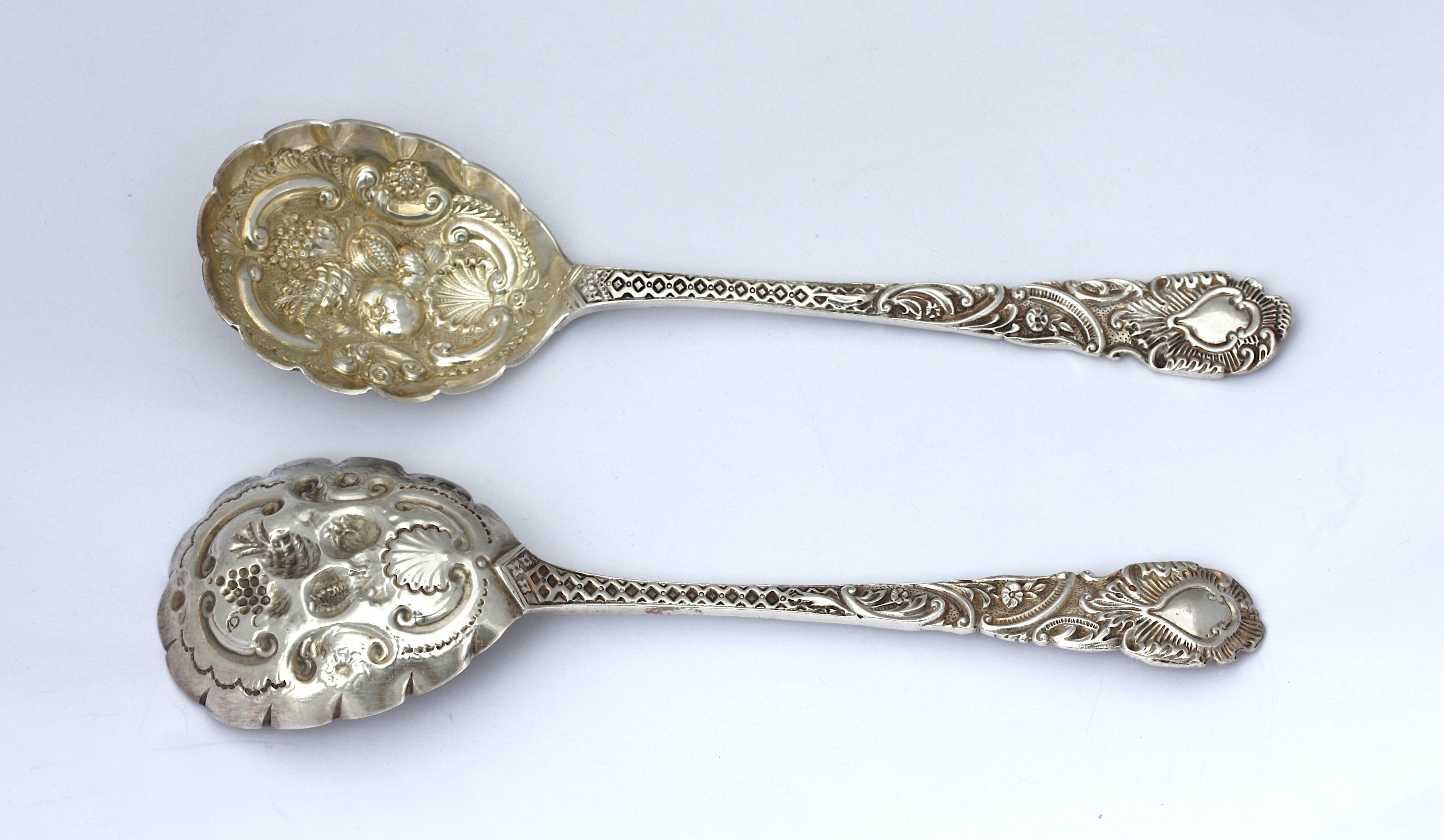
Pair of Victorian Silver Berry Spoons
English, 1865. In a rococo style, the scoops with repose scrolls, a shell, and fruit. 6.5 ozt.
