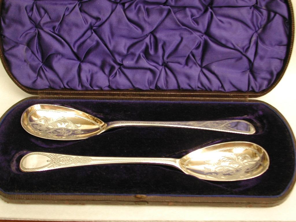 Pair of Victorian silver berry spoons, Newcastle 1878, Christian J Reid.
Pretty pair of fruit or dessert serving spoons with fantastic hand engraving
in bowls and on handles with a hint of original gilding.
These fit perfectly in a Victorian