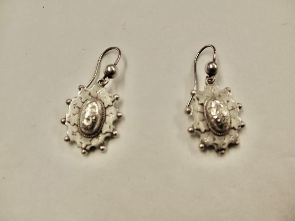 Pair Of Victorian Silver Etruscan Style Earrings,Circa 1880
This pair are in excellent condition and typical of the period.