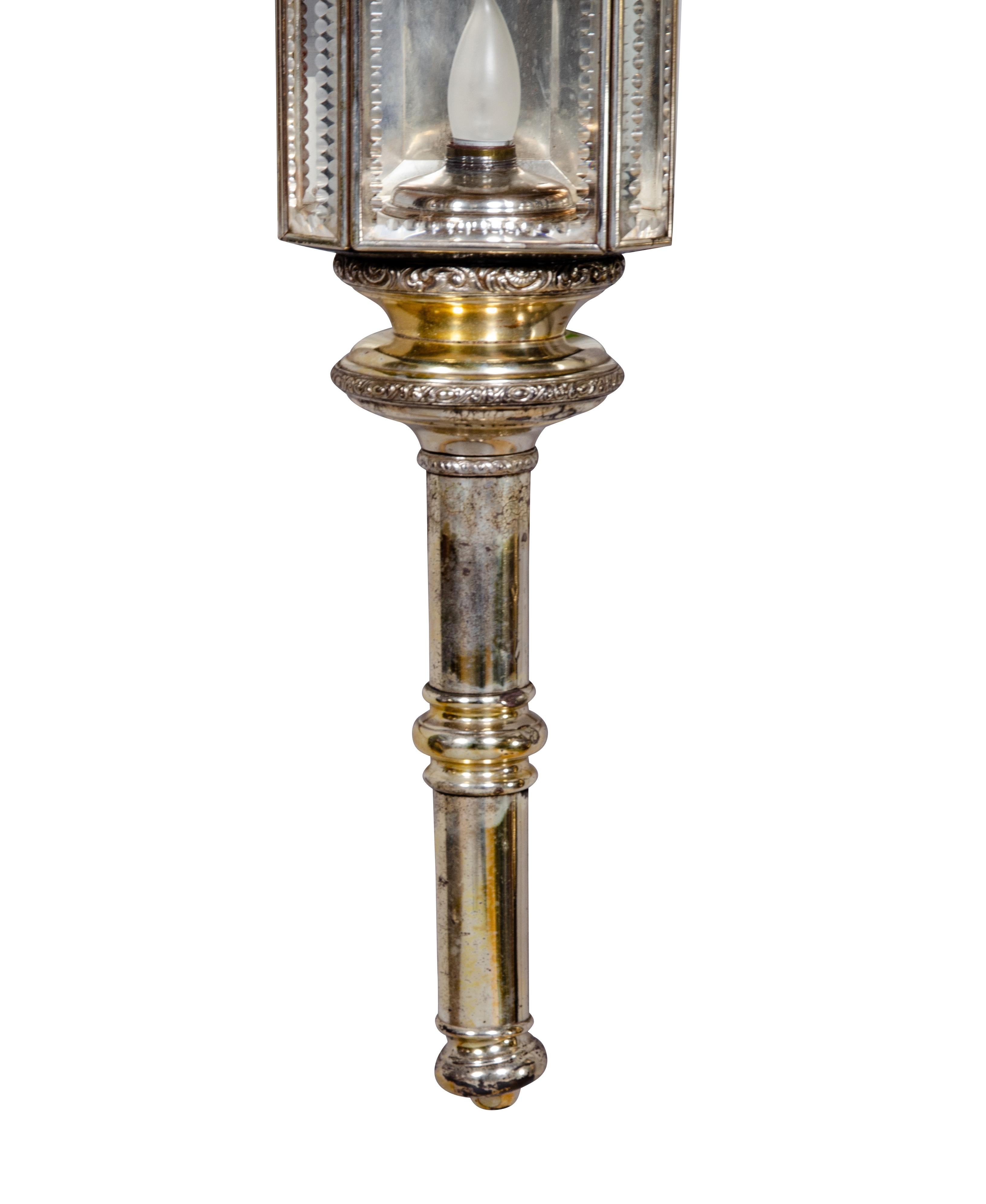 Electrified and includes wall mount. Typical form with beveled glass lantern.Originally mounted on a horse and carriage,