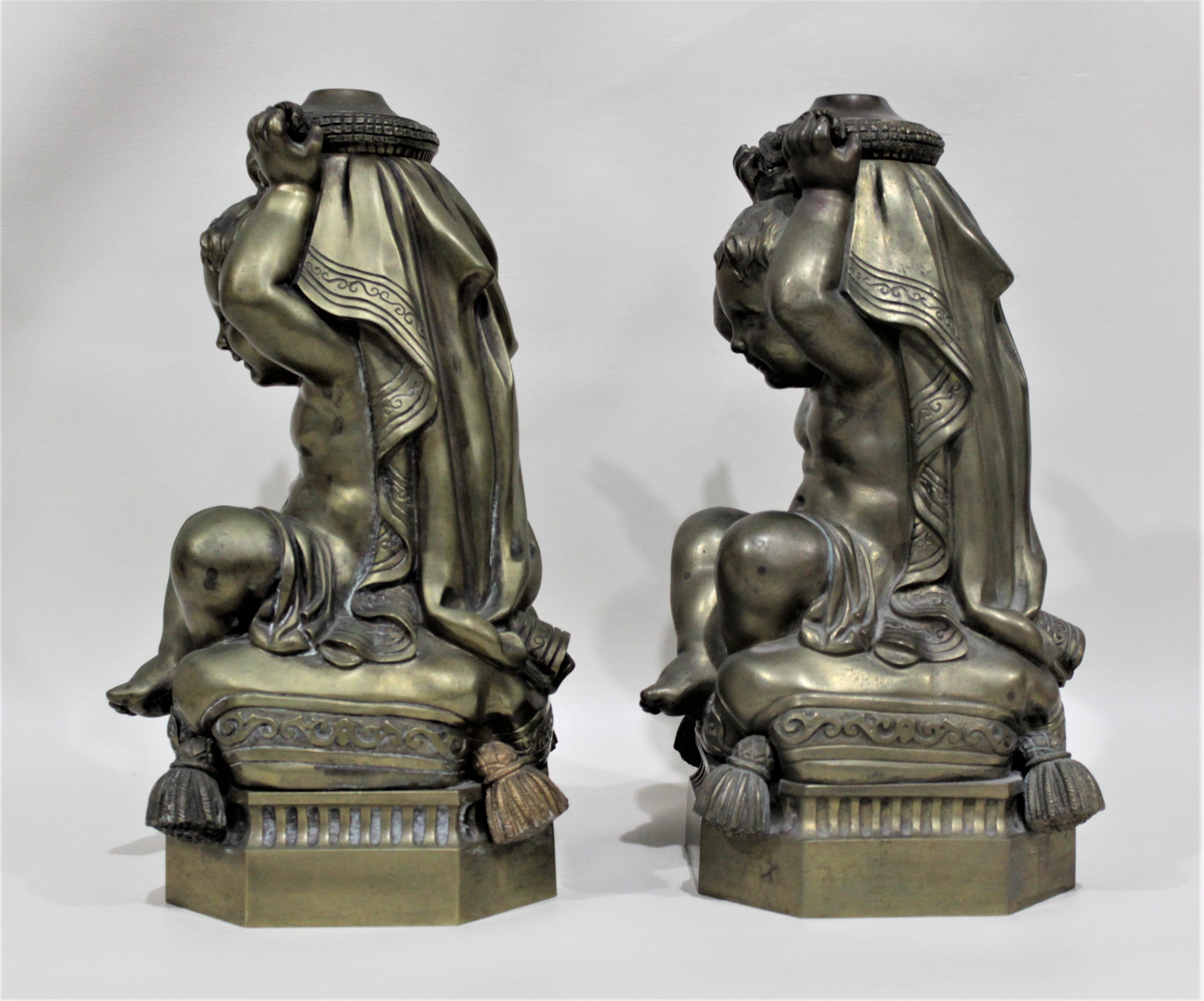 American Pair of Victorian Solid Cast Bronze Figural Cherub Oil Lamp Bases Holding Snakes For Sale
