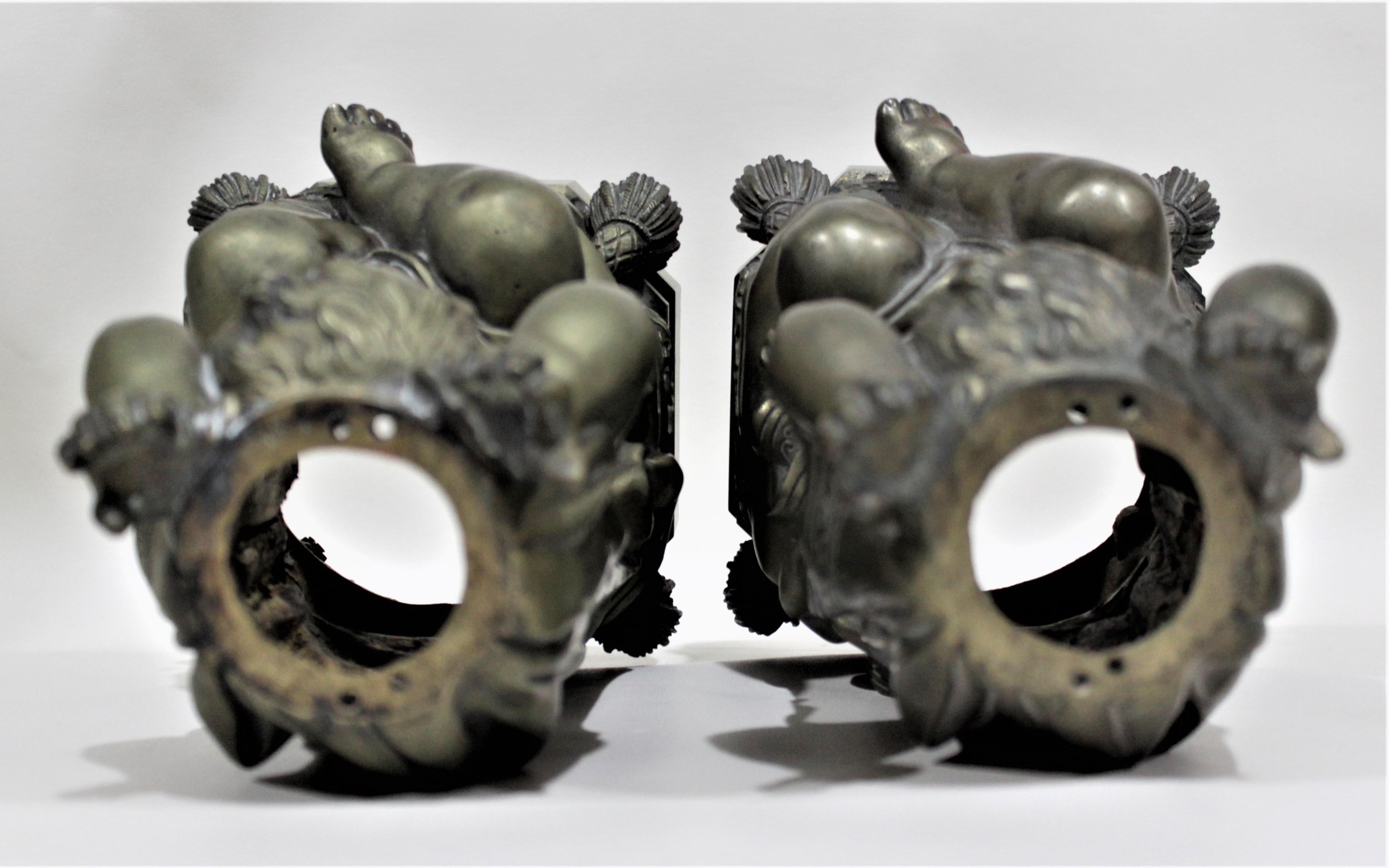 19th Century Pair of Victorian Solid Cast Bronze Figural Cherub Oil Lamp Bases Holding Snakes For Sale