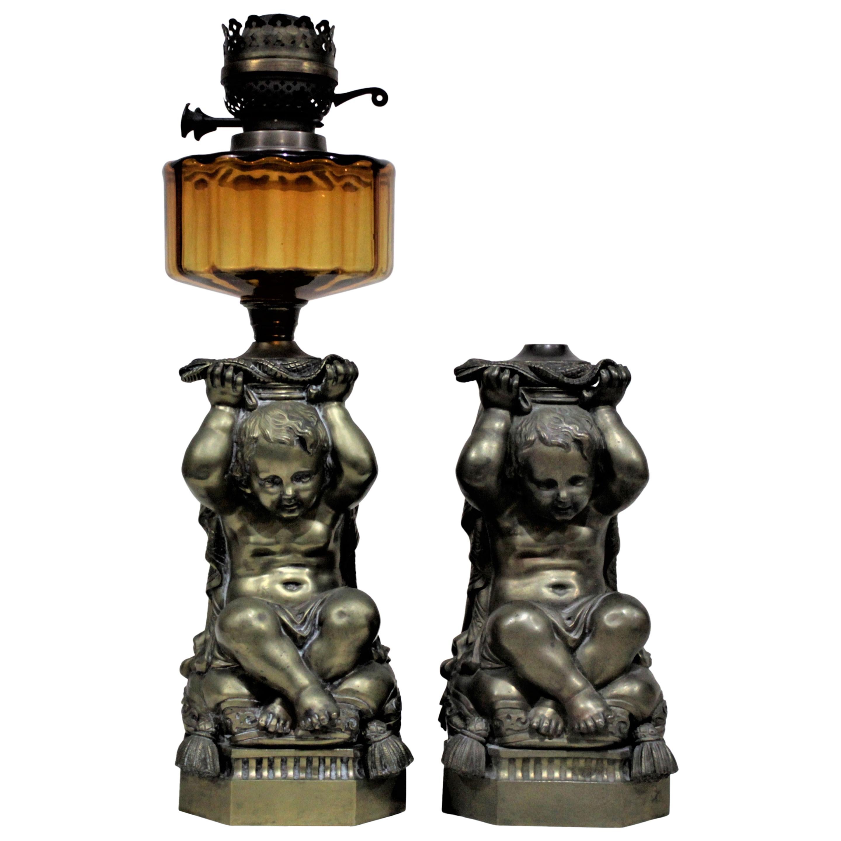 Pair of Victorian Solid Cast Bronze Figural Cherub Oil Lamp Bases Holding Snakes For Sale