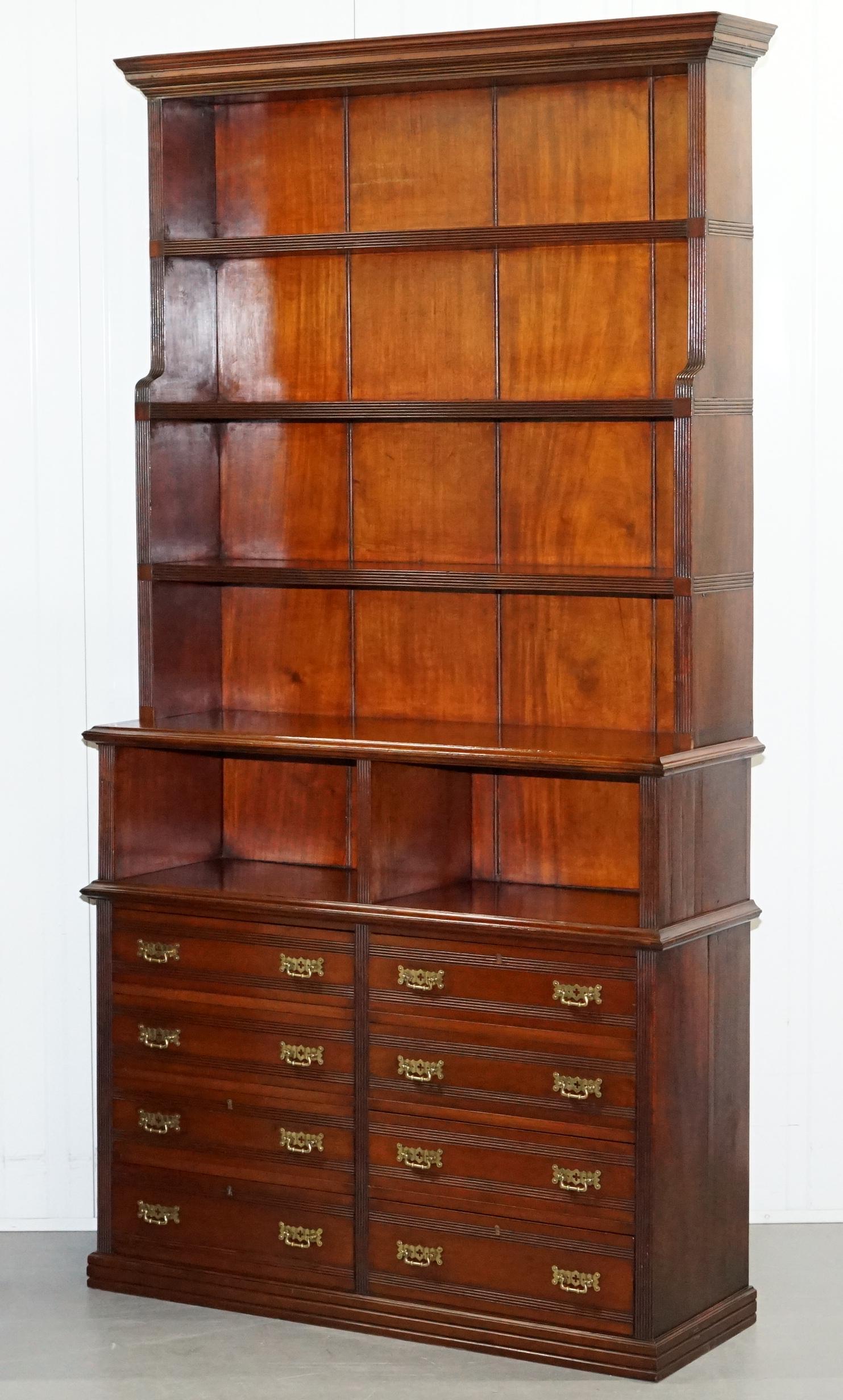 We are delighted to offer for sale this stunning pair of original solid Walnut Victorian Library waterfall bookcases with Haberdashery banks of drawers to the base

A truly stunning pair, very rare to find them in this timber from this period and