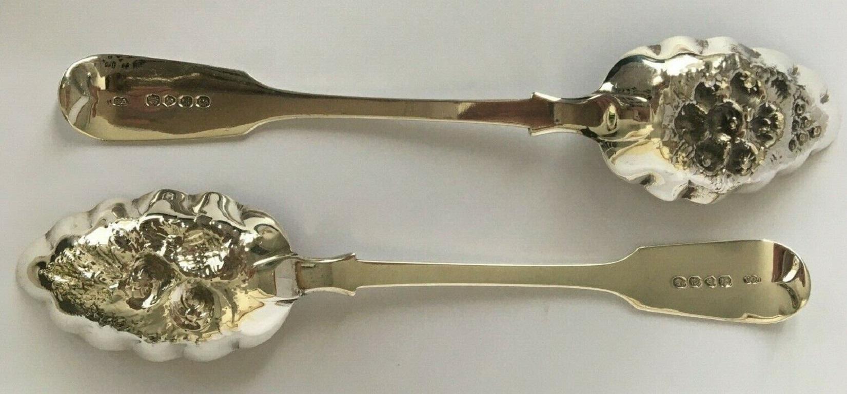 Pair of Victorian Sterling Silver Berry Fruit Serving Spoons from 1848

In excellent condition, this superb set features brilliantly crafted and gilded bowls with floral motifs. These spoons have a gilt finish to the bowls. The gilding is still