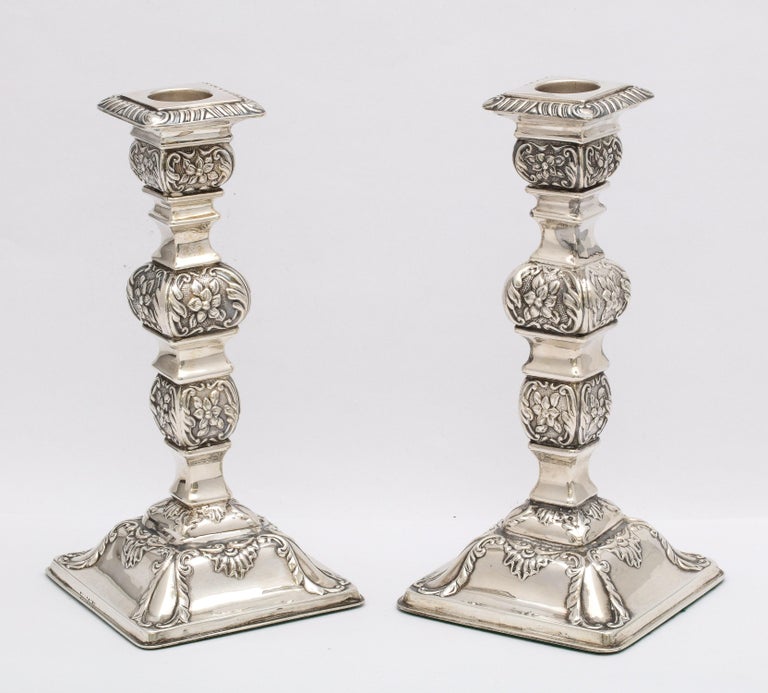 Pair of Victorian, sterling silver candlesticks, Birmingham, England year-hallmarked for 1888-1889, William Hutton and Sons - makers. Each candlestick measures 7 1/2 inches high x 3 1/2 inches wide (at widest point) x 3 1/2 inches deep (at deepest