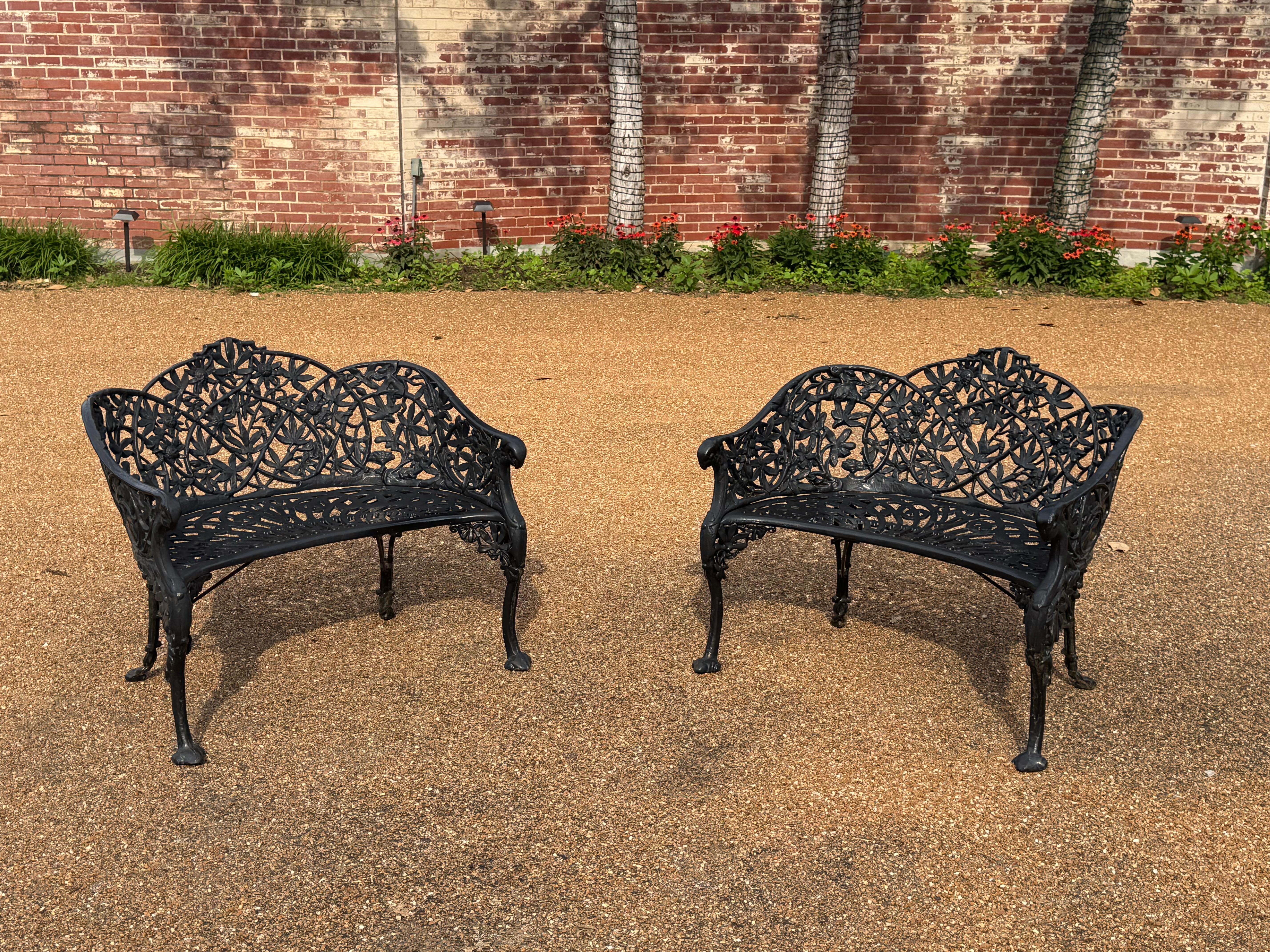 Lovely pair of vintage cast iron garden benches / settees painted black, circa 1920s, attributed to 