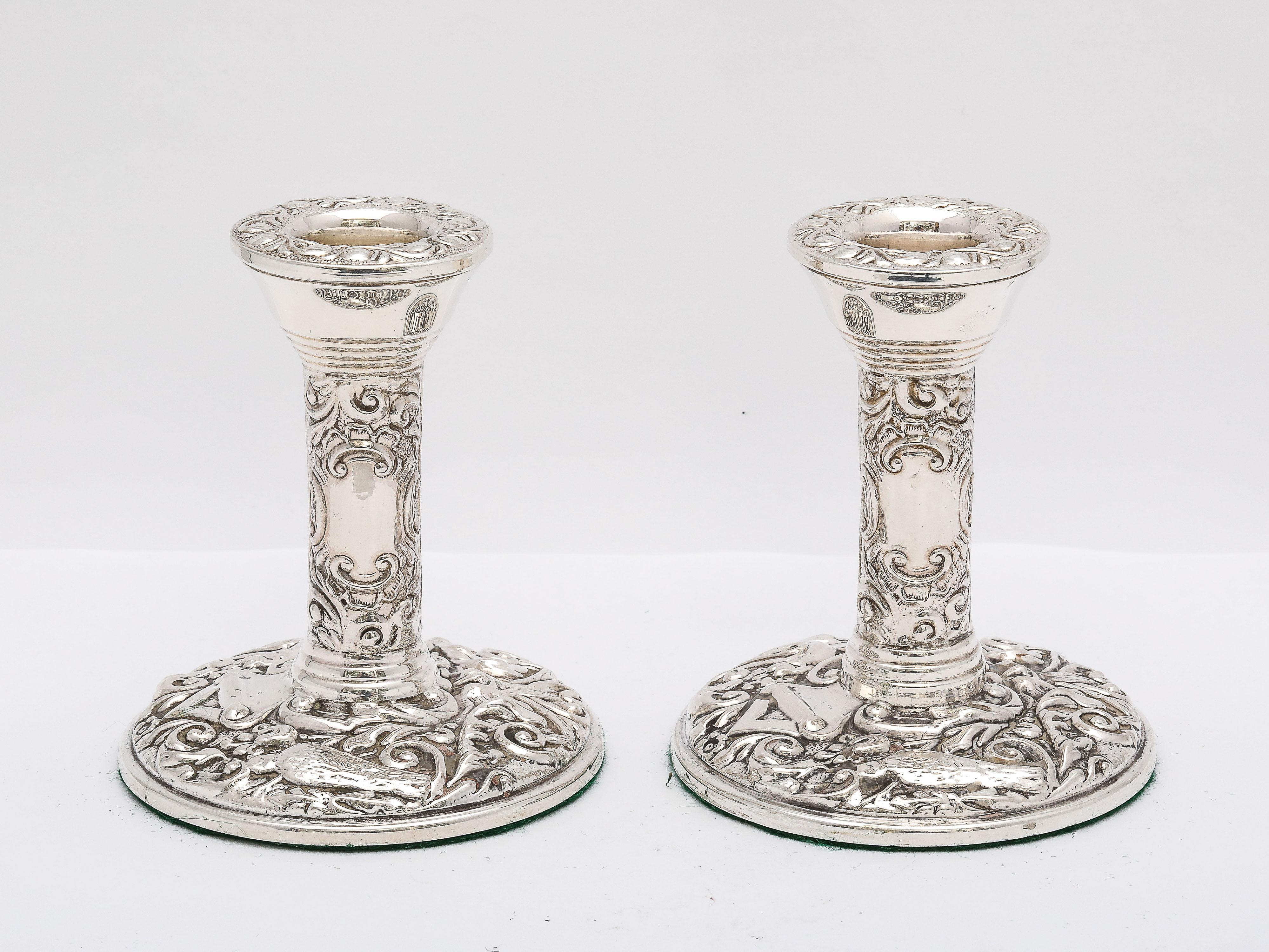 Pair of Victorian-Style, sterling silver candlesticks, Birmingham, England, year-hallmarked for 1972, Broadway and Co. - makers. Each candlestick measures 4 inches high x 3 1/4 inches diameter (across base). Pair is weighted. Each candlestick is