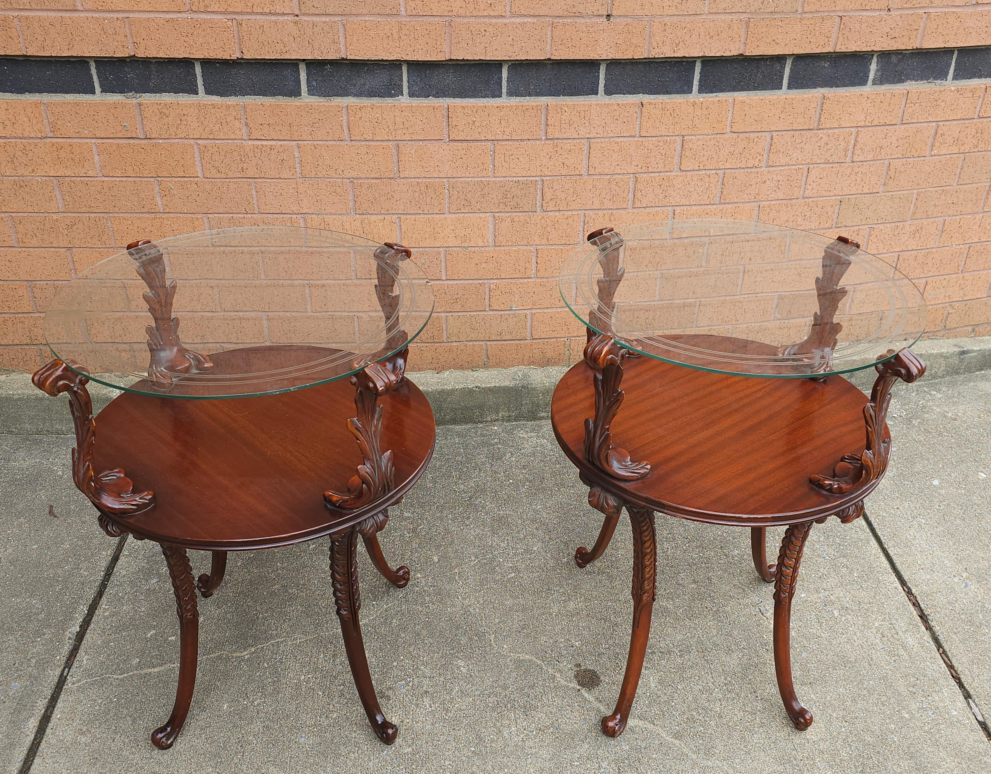 Pair of Victorian Style Two Tier Carved Mahogany with acanthus leaves and Glass Top Side Tables. Measures 20