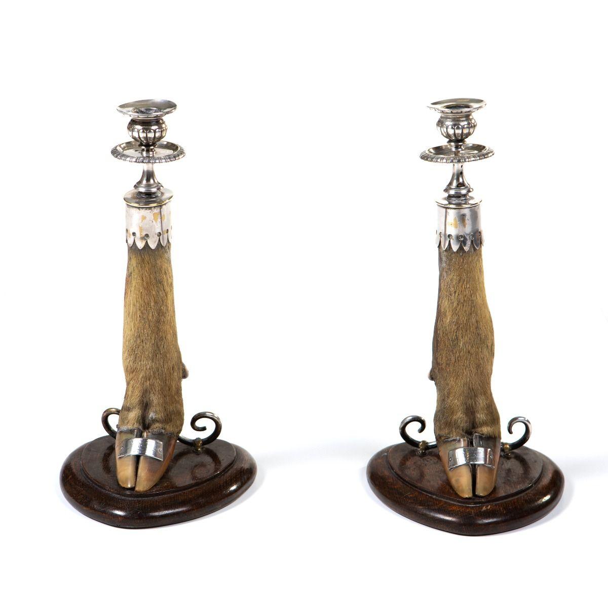 Rare pair of Victorian trophy candlesticks, made from deer hooves mounted on oval hardwood bases.
The candle sockets are richly decorated in silver-plated brass. Each hoof bears an engraved plaque noting the time and place of the hunt:
Horton Plains