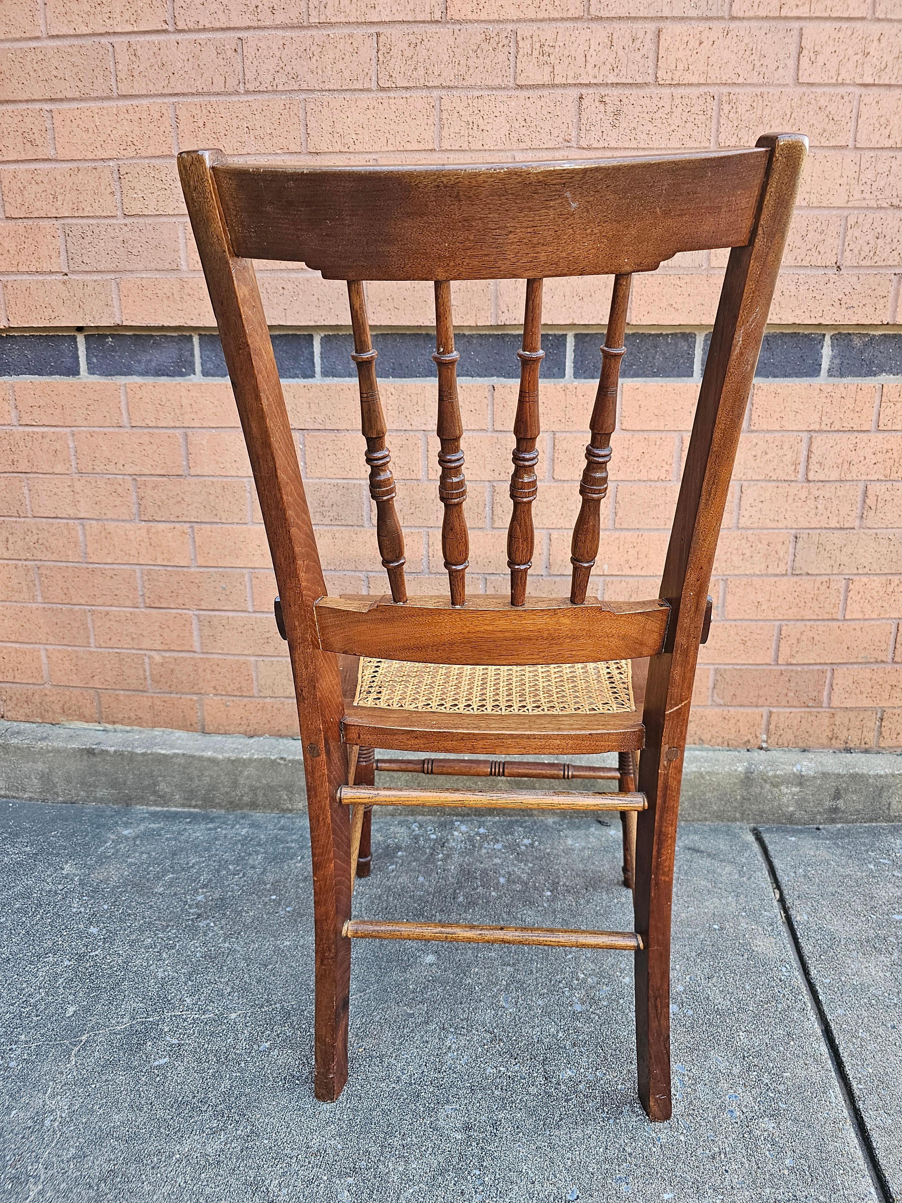 20th Century Pair of Victorian Walnut Carved and Spindle Cane Seat Side Chairs For Sale