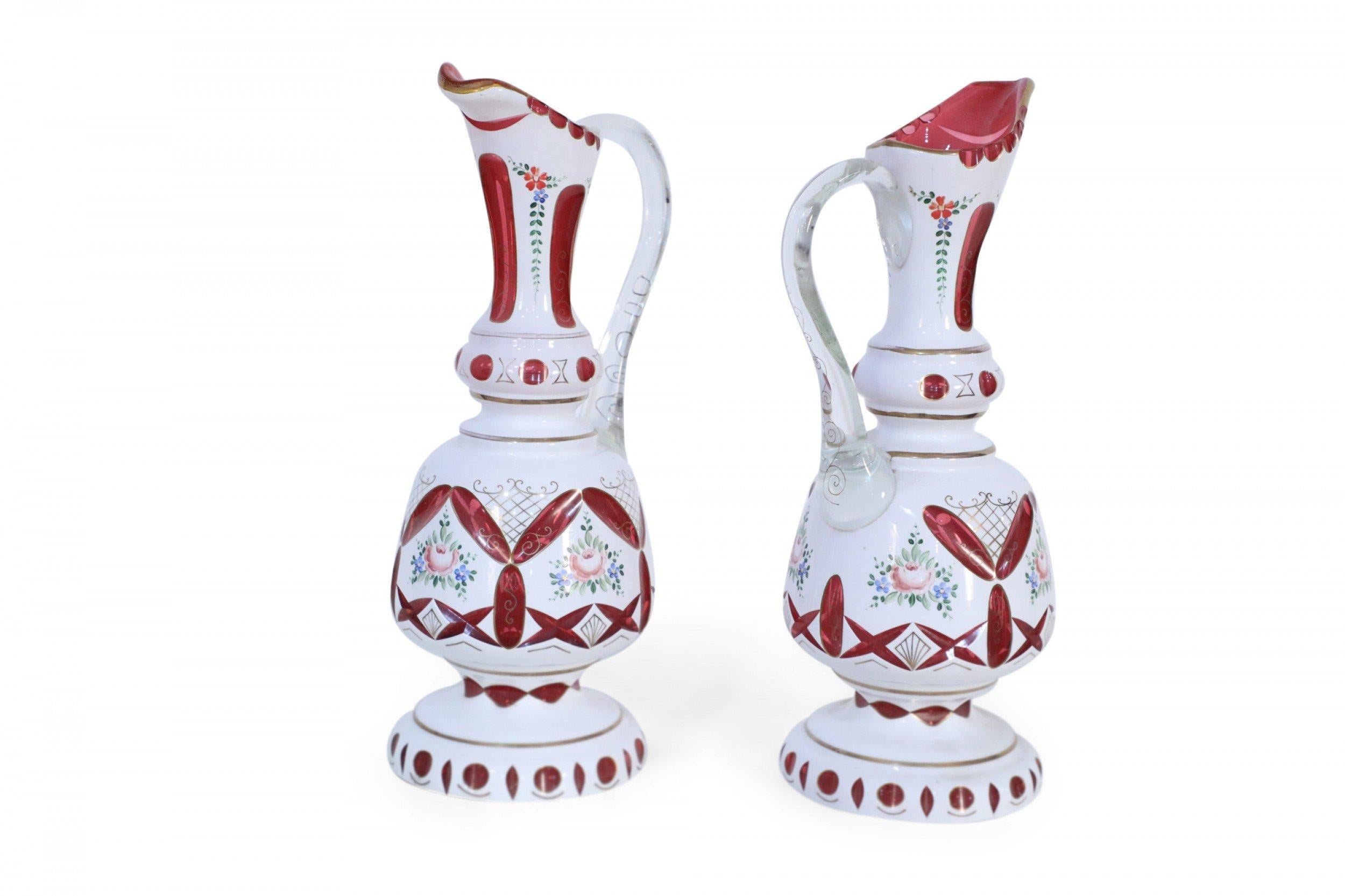 Pair of Victorian White and Ruby Opaline Glass Ewers In Good Condition For Sale In New York, NY