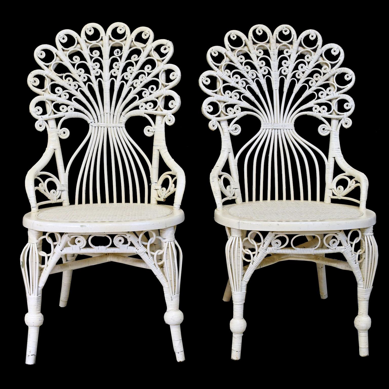 A lovely pair of American Victorian chairs in hand-woven wicker with peacock back and bird-cage legs, possibly Heywood Wakefield, circa 1880.
Measures: 19 1/2