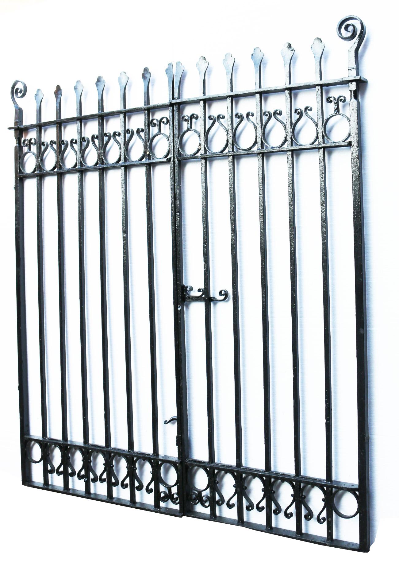 These driveway gates are in excellent structural condition, have no hinges or latch and are finished with old black paint. Very heavy, solid gates. 
Height 169 cm
Centre Height 154 cm
Width 238.5 cm
Depth 5.5 cm