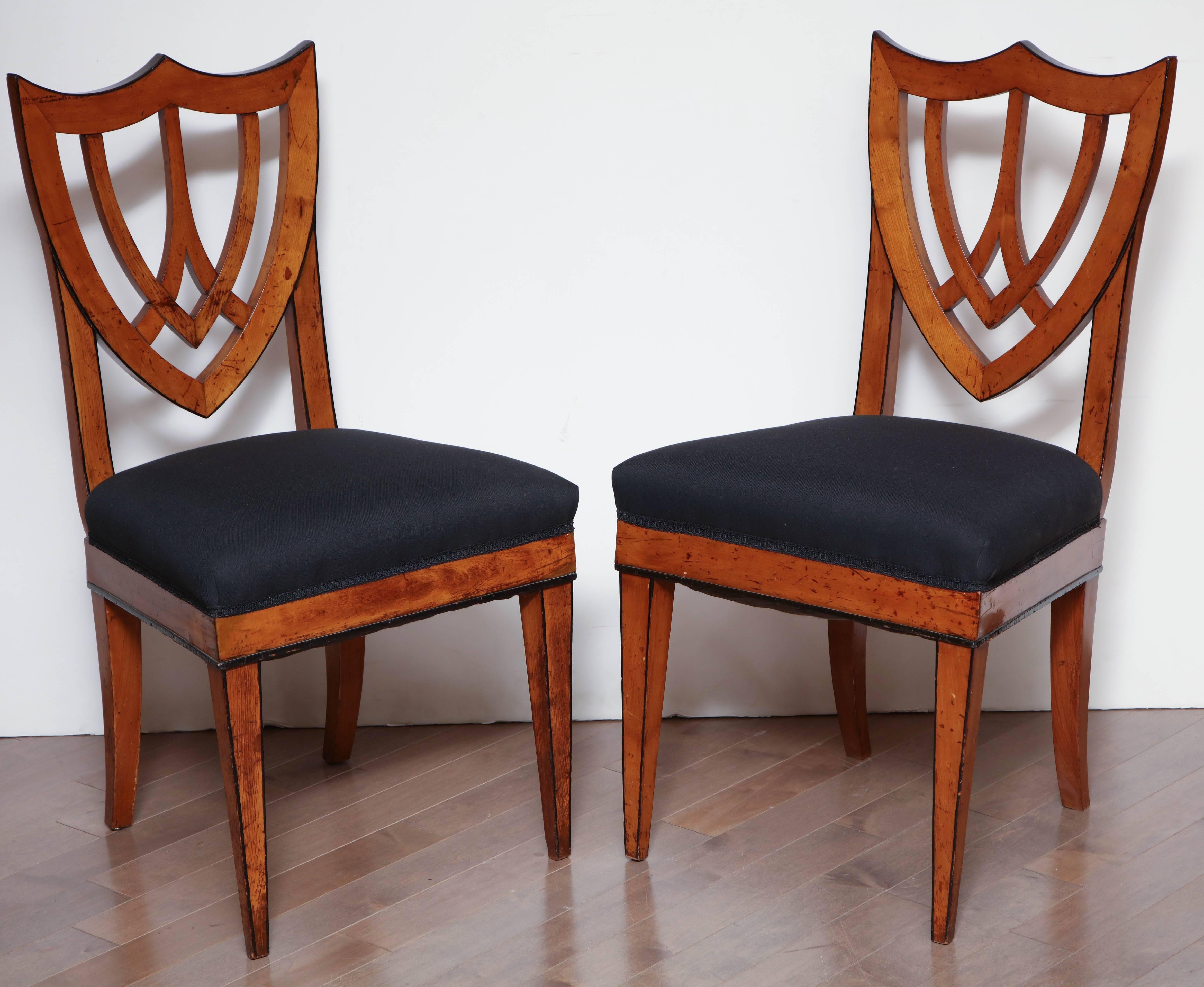 Pair of Viennese side chairs in fruitwood, circa 1830.