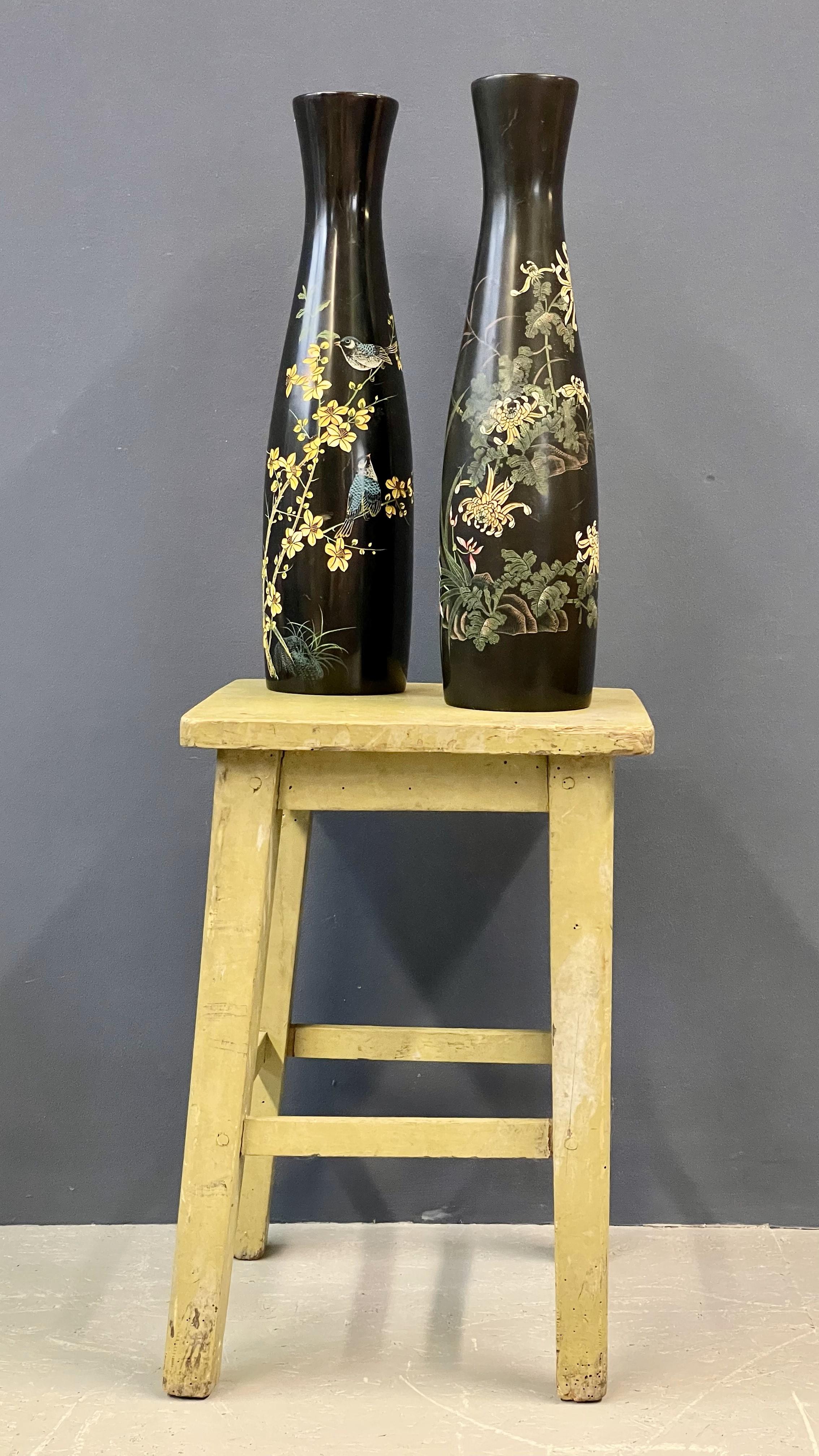 Add elegance to your décor with this pair of black Vietnamese vases. Their sleek, minimalist design and rich black finish make them perfect accents for any modern or traditional setting.