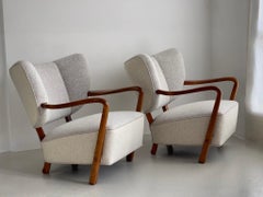 Rare pair of 1930s Viggo Boesen danish lounge chairs reupholstered in wool.