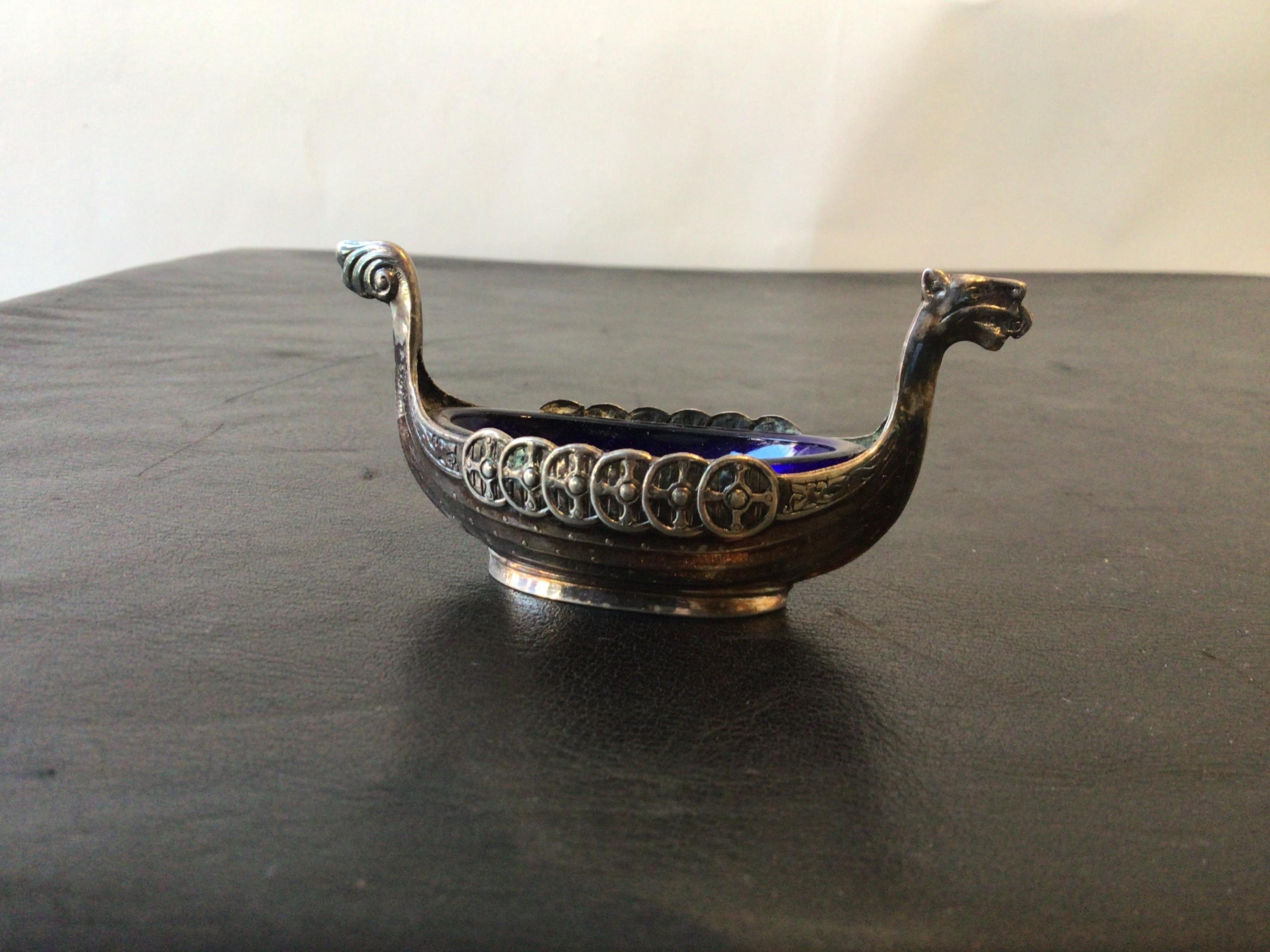 Pair of 1960s Swedish sterling cellars in the form of Viking boats. Cobalt blue glass inserts.