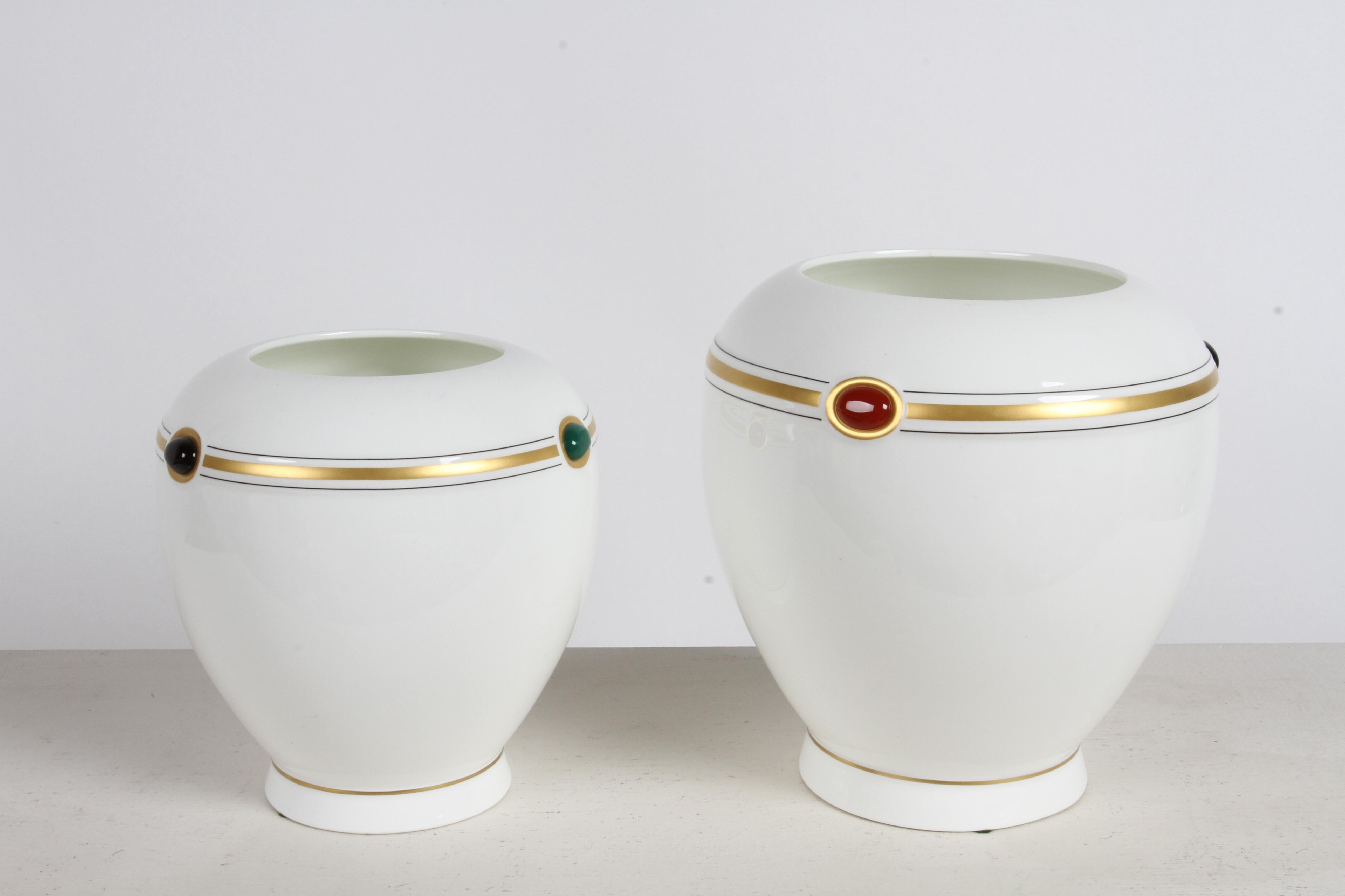 Pair of Villeroy & Boch vases / urns 'Bijou' designed by Paloma Picasso in the late 1970s  Bone china, bulbous form with red. green and blue colored jewel stones and gold stripe decoration. Signed on base Paloma Picasso  'Bijou' Bone China Henrich :