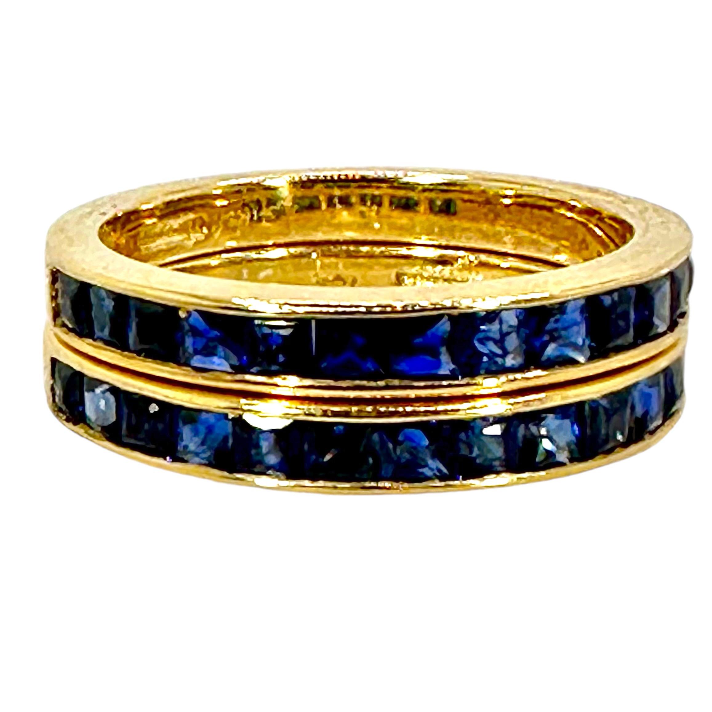 A beautiful pair of 18K yellow gold bands set halfway around each ring with square cut sapphires. These wearable bands look great by themselves or by accenting your favorite eternity band or solitaire ring. Each ring is stamped 18K as well as 1.31