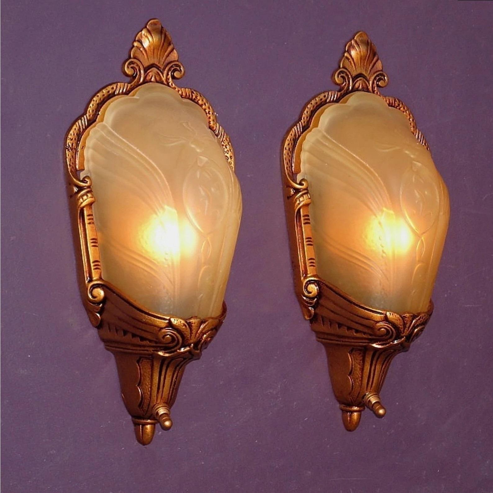 Priced for the pair.
If you are dealing with building codes which require a completely covered bulb for a walk in closet these wonderful antique slip shade wall sconces could be just the answer. Or if the question is 
