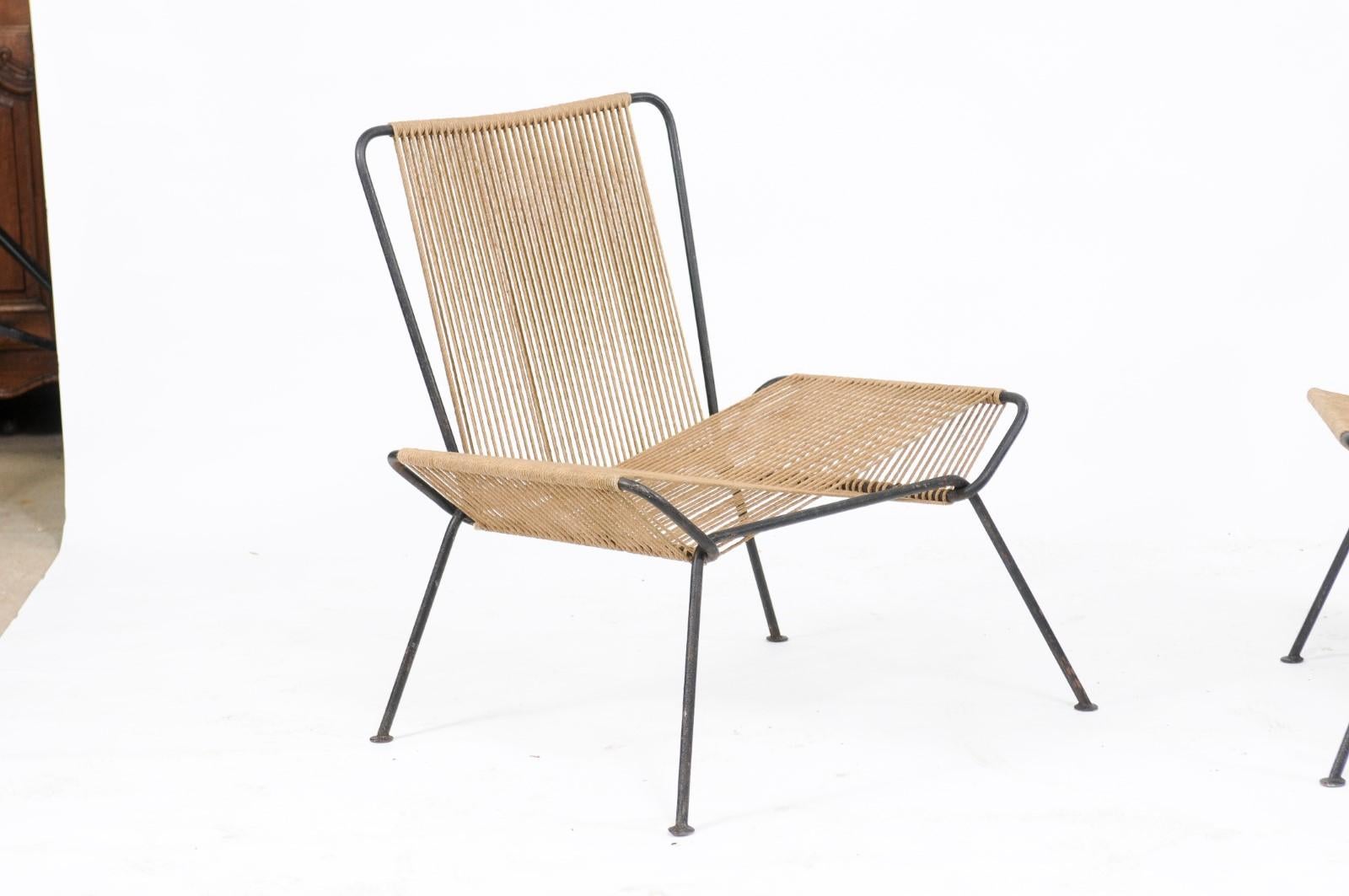 A pair of vintage midcentury iron and hemp string chairs in the style of Allan Gould from the 1950s. This is a very rare and hard-to-find pair of iron and hemp string chairs, from the 1950s, in the style of Allan Gould (and possibly designed by him