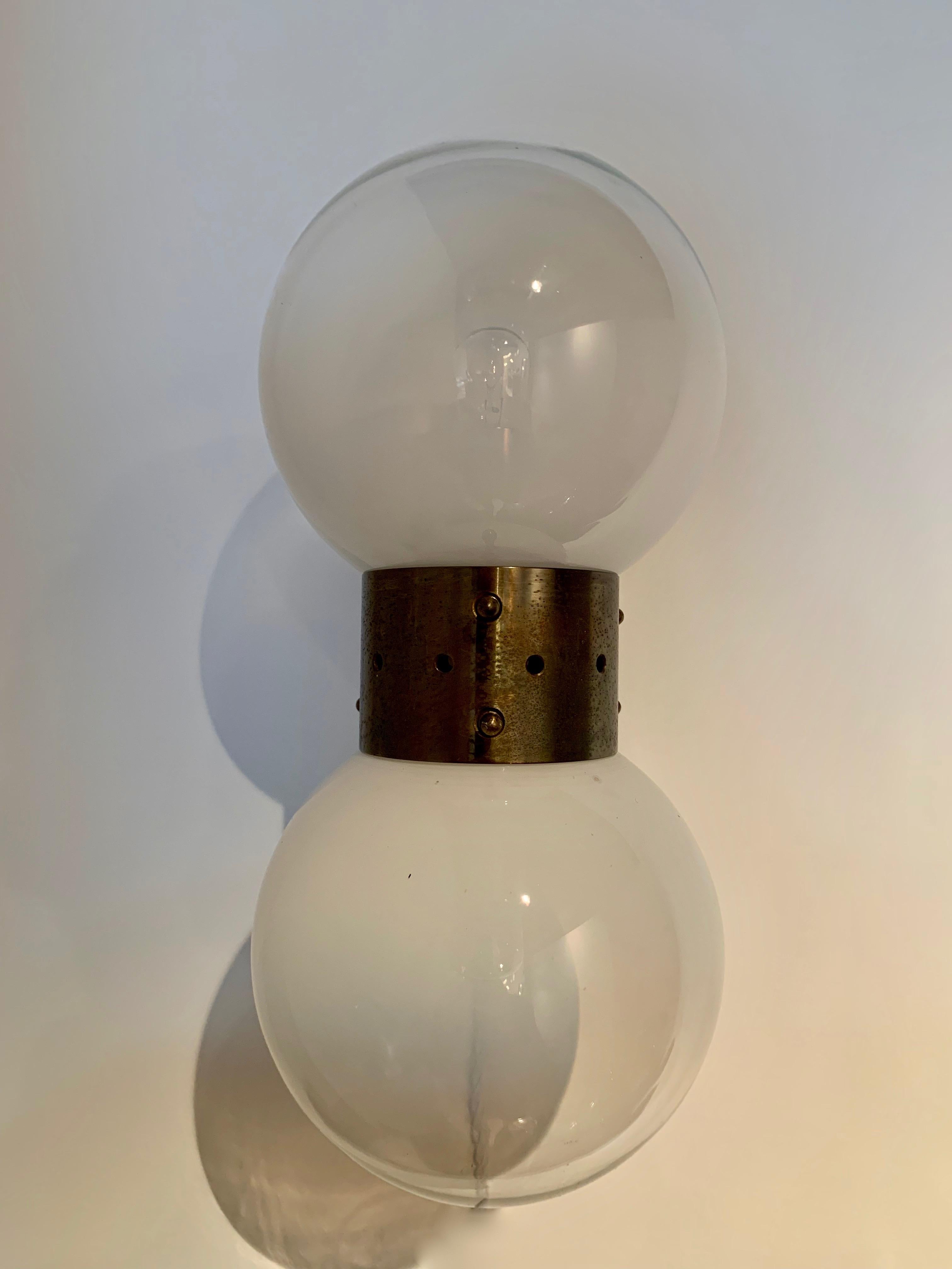 Pair of original 1950s vintage wall sconces with Murano glass orbs, graduated from completely clear at the top to opaline at the base. 

Takes two E14 bulbs. Wired for the US or EU.