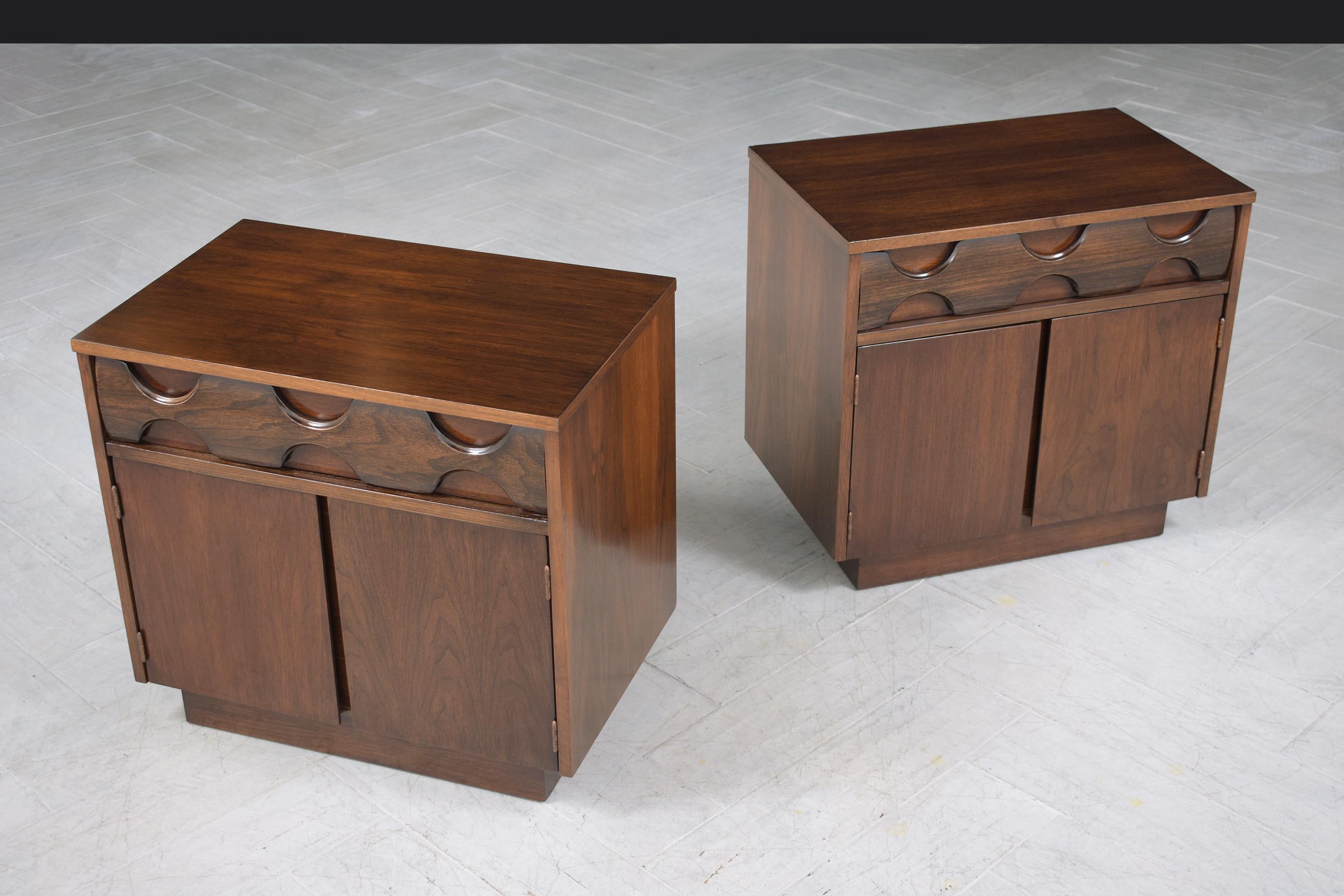 An extraordinary pair of vintage mid-century modern nightstands are in great condition beautifully hand-crafted out of walnut wood and are completely restored and refinished by our professional craftsmen team. This set of two side bed tables