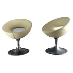 pair of vintage aluminum cast leather eco chairs