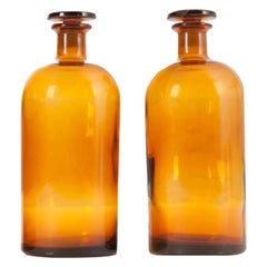 Pair of Antique Amber Glass Apothecary Jars with Lids