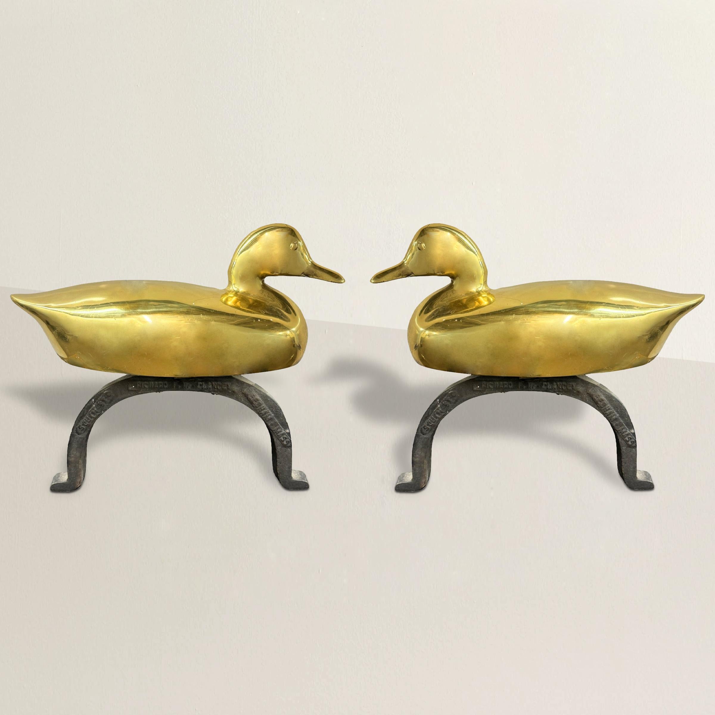 Embrace the timeless charm of the great outdoors with this exquisite pair of vintage American cast brass and iron duck andirons. Crafted with meticulous attention to detail, these andirons feature a captivating design of majestic ducks, evoking a