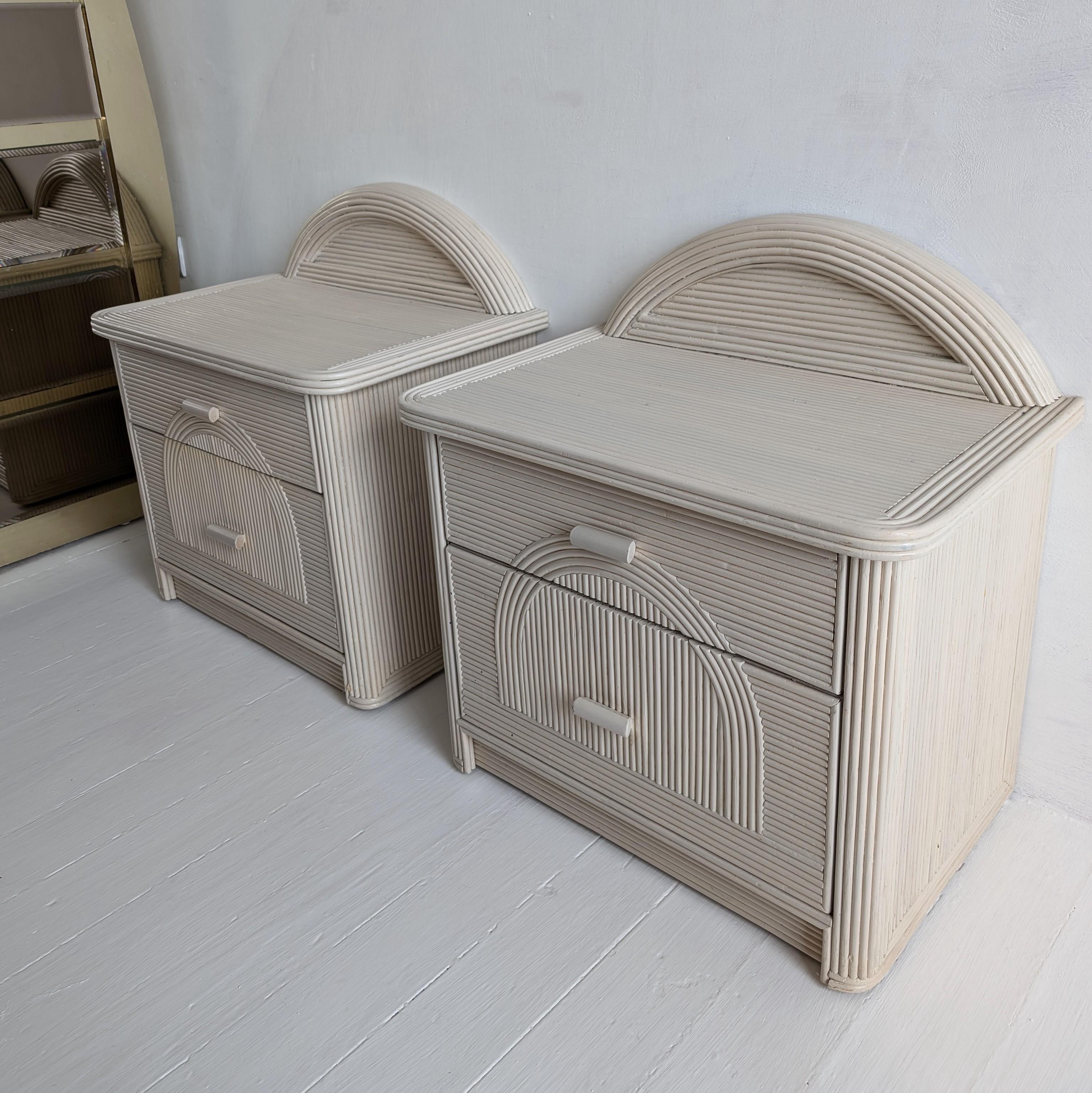 Cane Pair of vintage American pencil reed / cane bedside cabinets with arched backs