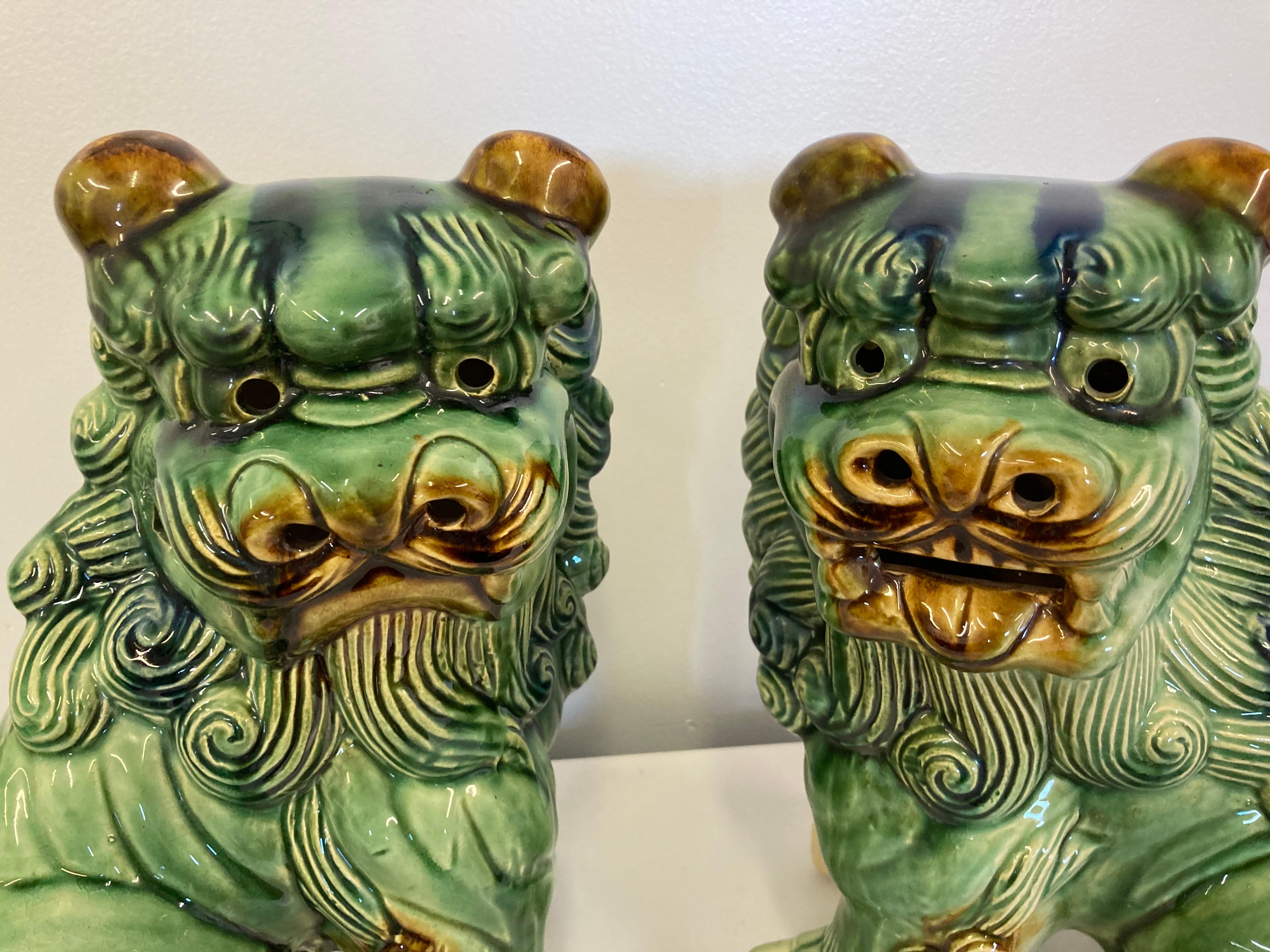 Offered is a pair of vintage or antique Chinese Food Dog figures. Features two dogs with their mouths open in slightly different manners. In good condition with some slight crazing and imperfections/bumps throughout. Please look at pictures