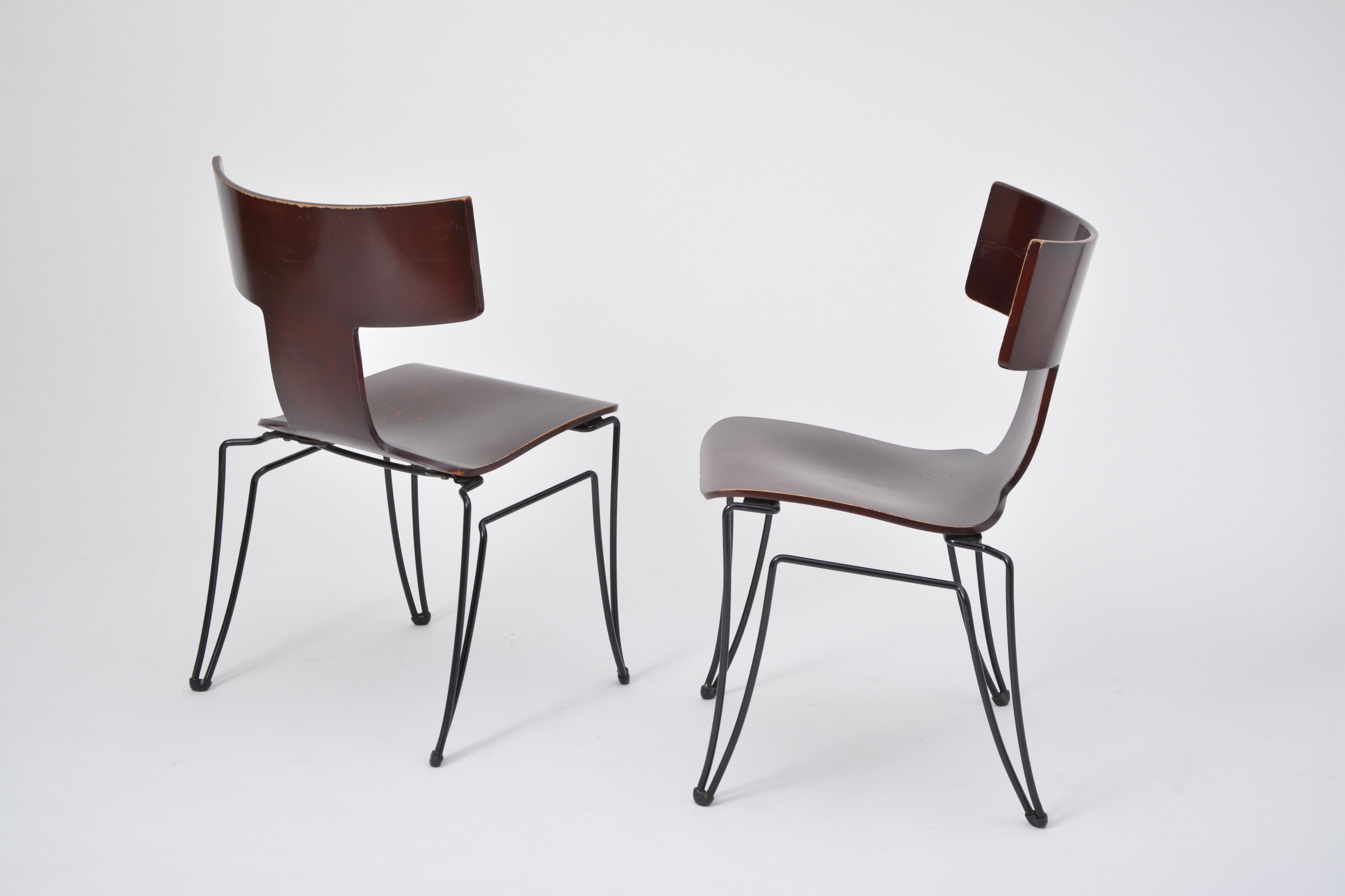 This set of two chairs was produced by Donghia in the 1980s. The model Anziano was designed by John Hutton. The structures are made of black coated steelwire, the seats are made of molded beechwood veneer. The chairs are stackable.