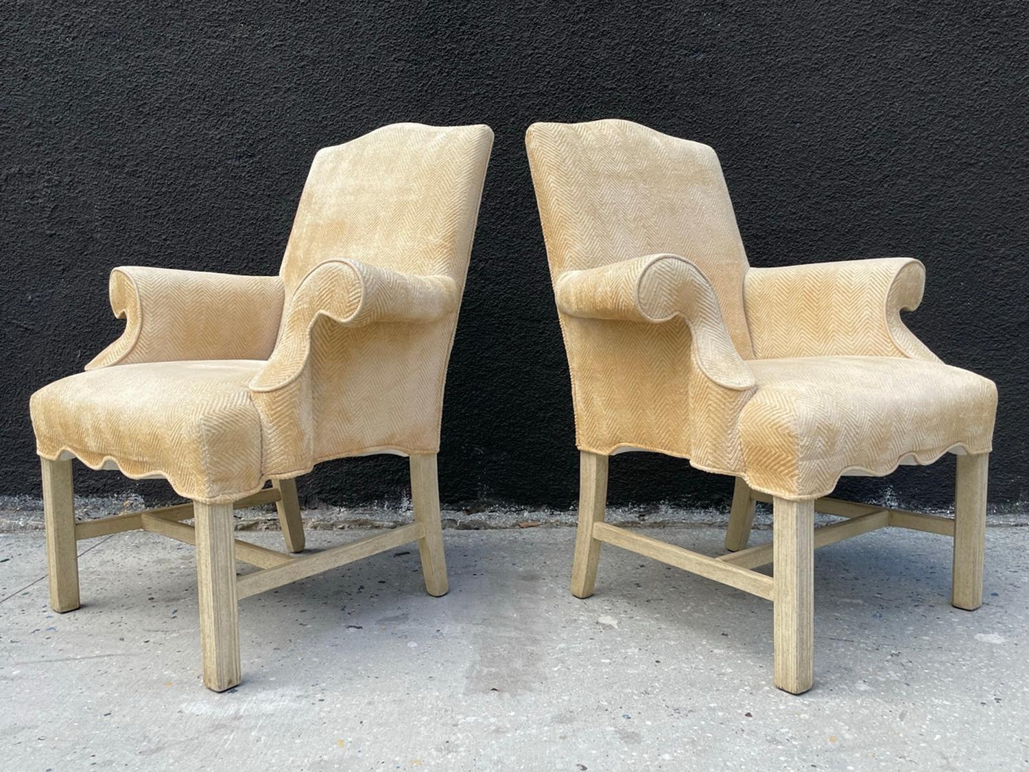 Pair of vintage arm chairs upholstered in a butter cream colored fabric.

Measurements:
35 inches wide x 29 inches deep x 40.50 inches high x 18.50 inches seat height x 27.50 arm height.
 