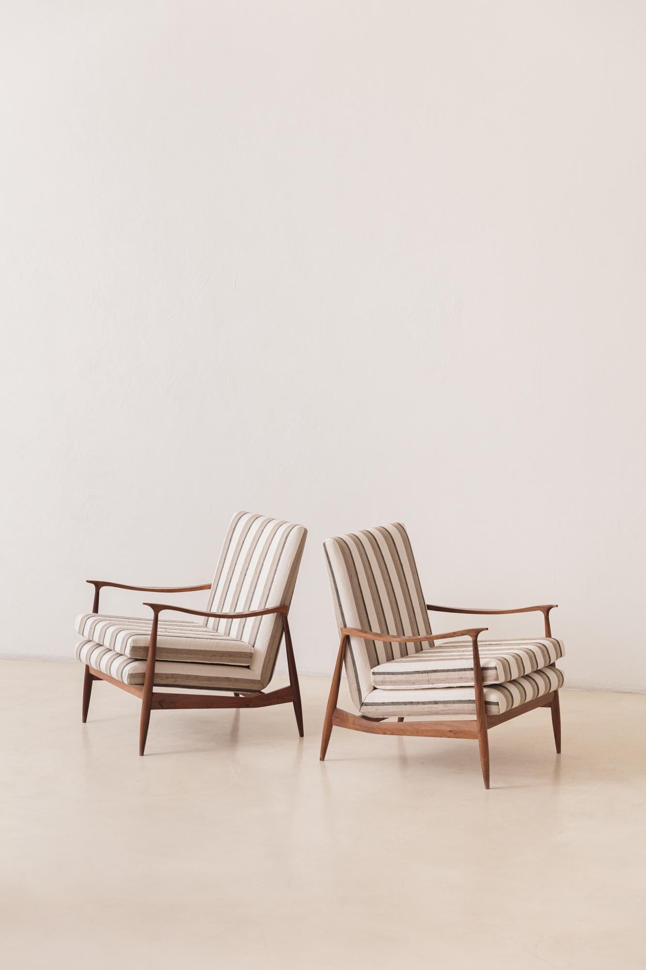 These Rosewood Armchairs were produced in the 1950s by the Brazilian company Móveis Cimo, a pioneer in Brazilian furniture industrialization.

Cimo's history starts in 1921 with a wood boxes factory, and ended in 1982 as the furniture factory