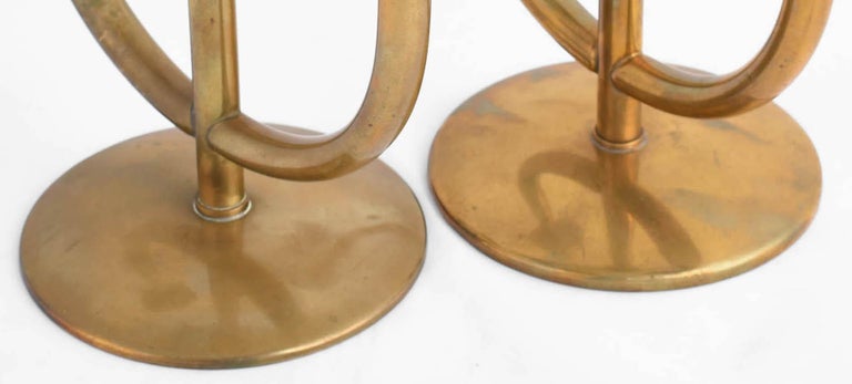 Pair of vintage Art Deco candelabras is a pair of original decorative objects realized in the 1930s.

Designed by Harald Buchrucker, made in Germany. 

Original brass objects. 

Dimensions: H. 22.5 cm ca.

Mint conditions, several vintage