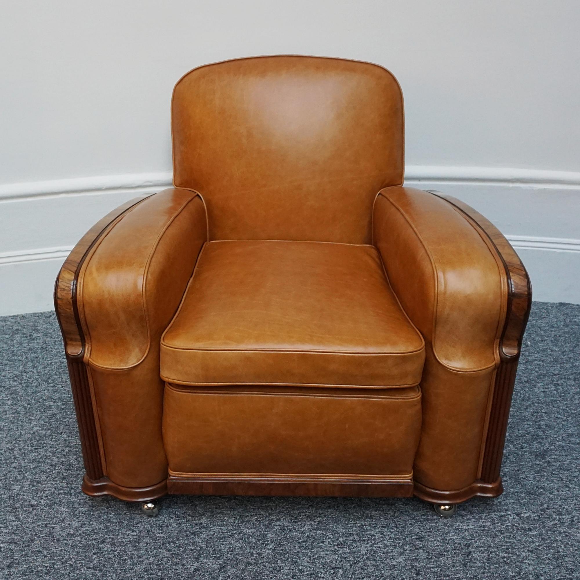 A pair of Art Deco Club Chairs. Shaped burr and figured walnut to the sides and the back. Burr walnut and fluted banding. Veneered throughout. Re-upholstered in brown leather. 

Dimensions: H 79cm W 92cm D 85cm Seat H 48cm W 50cm D 61cm

Origin: