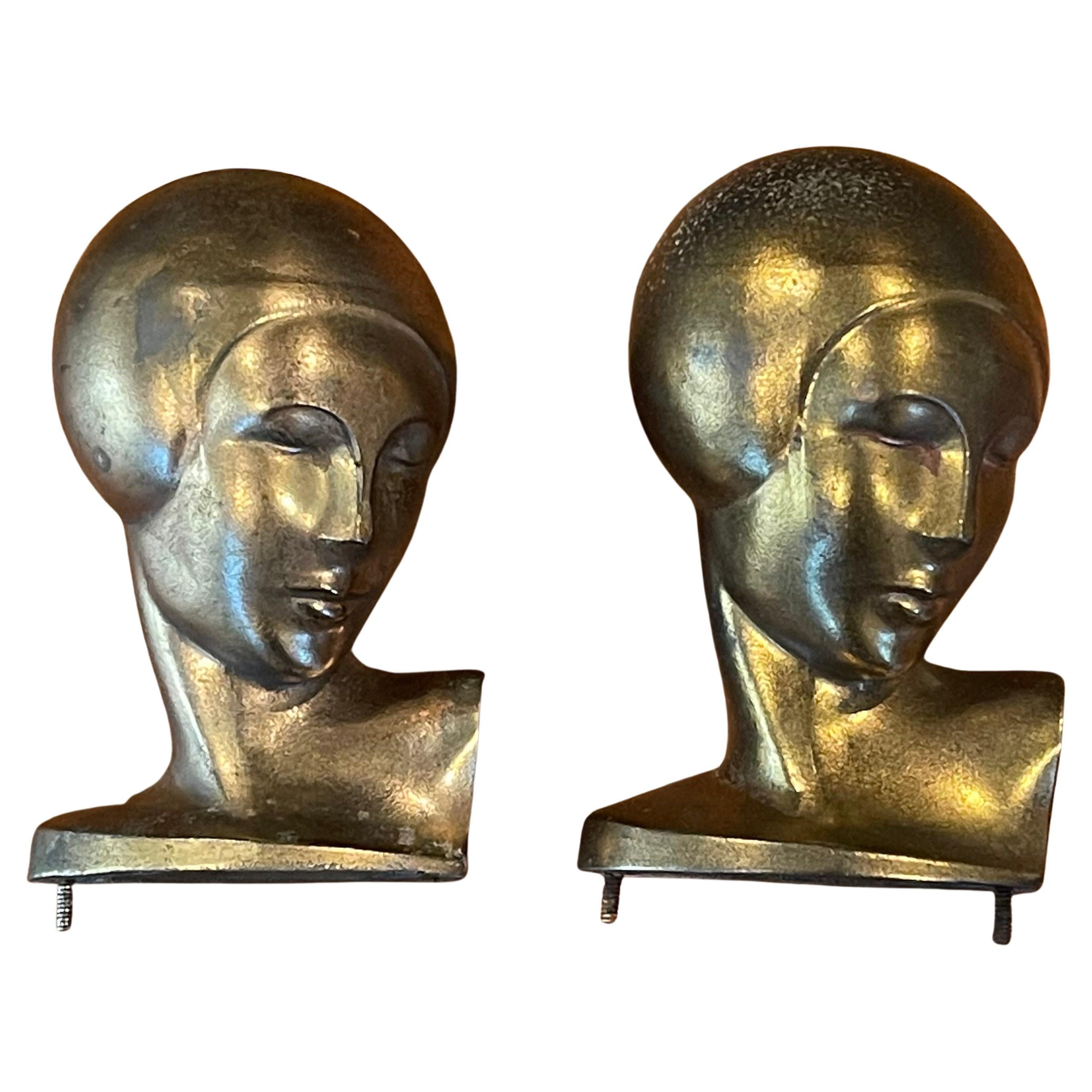 A really unique pair of vintage art deco goldtone heads or busts of a woman by Frankart, circa 1930s. They are in original condition with a fine patina, some light oxidation and some surface scratches and measure 3.75