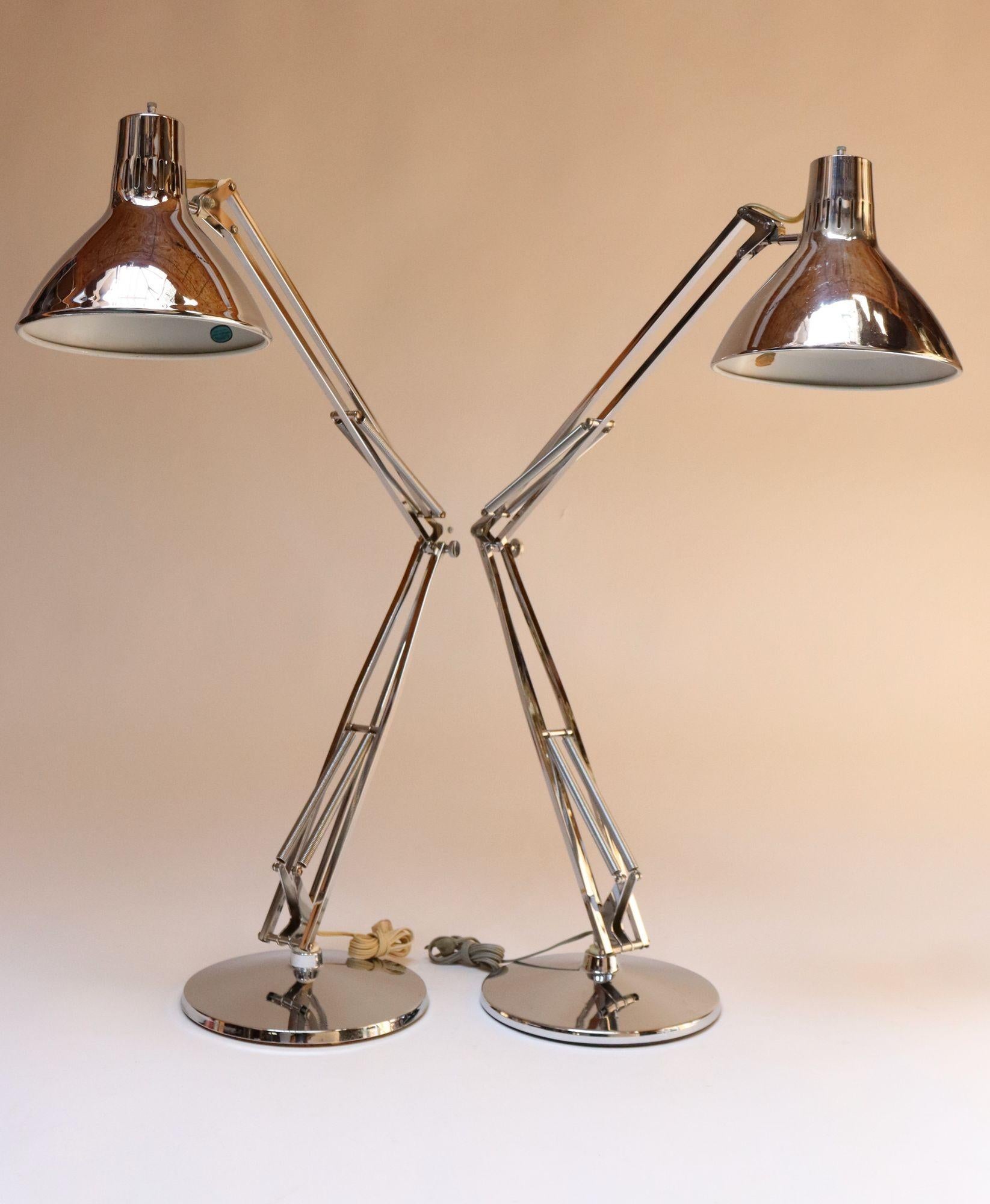 Pair of vintage Luxo articulating chrome desk/task lamps on weighted chrome bases originally designed in 1937 by Jac Jacobsen (these examples are from the early 1960s, evidenced by their early tags and metal interior shades, which were later