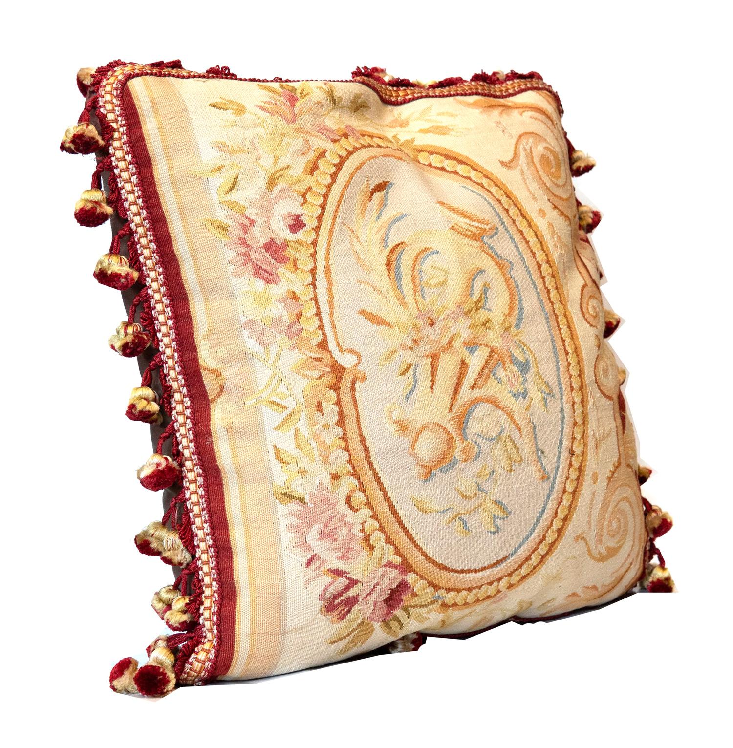 These cushions are fine examples of needlepoints from the 1990s, constructed in china with the traditional french Aubusson style and technique. These Aubusson style cushions feature a floral cameo design in the centre woven in accents of brown and