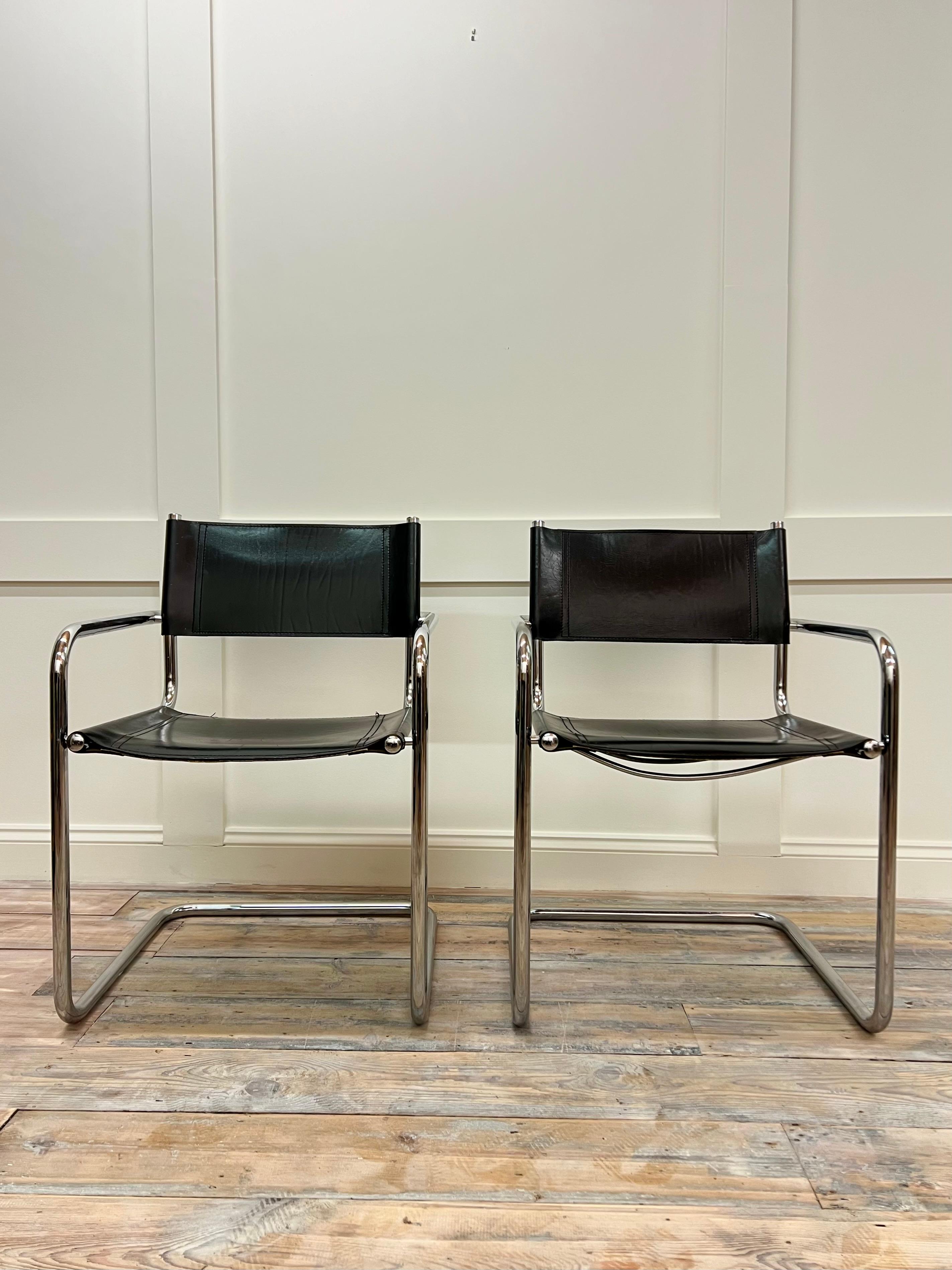 Set of 2 chrome metal armchairs model B34 by Marcel Breuer, reissued under license by the Italian company Matteo Grassi in the 1960s.  Chromed  tubular steel structure, the back and seat are upholstered in thick black leather, stitched with saddle