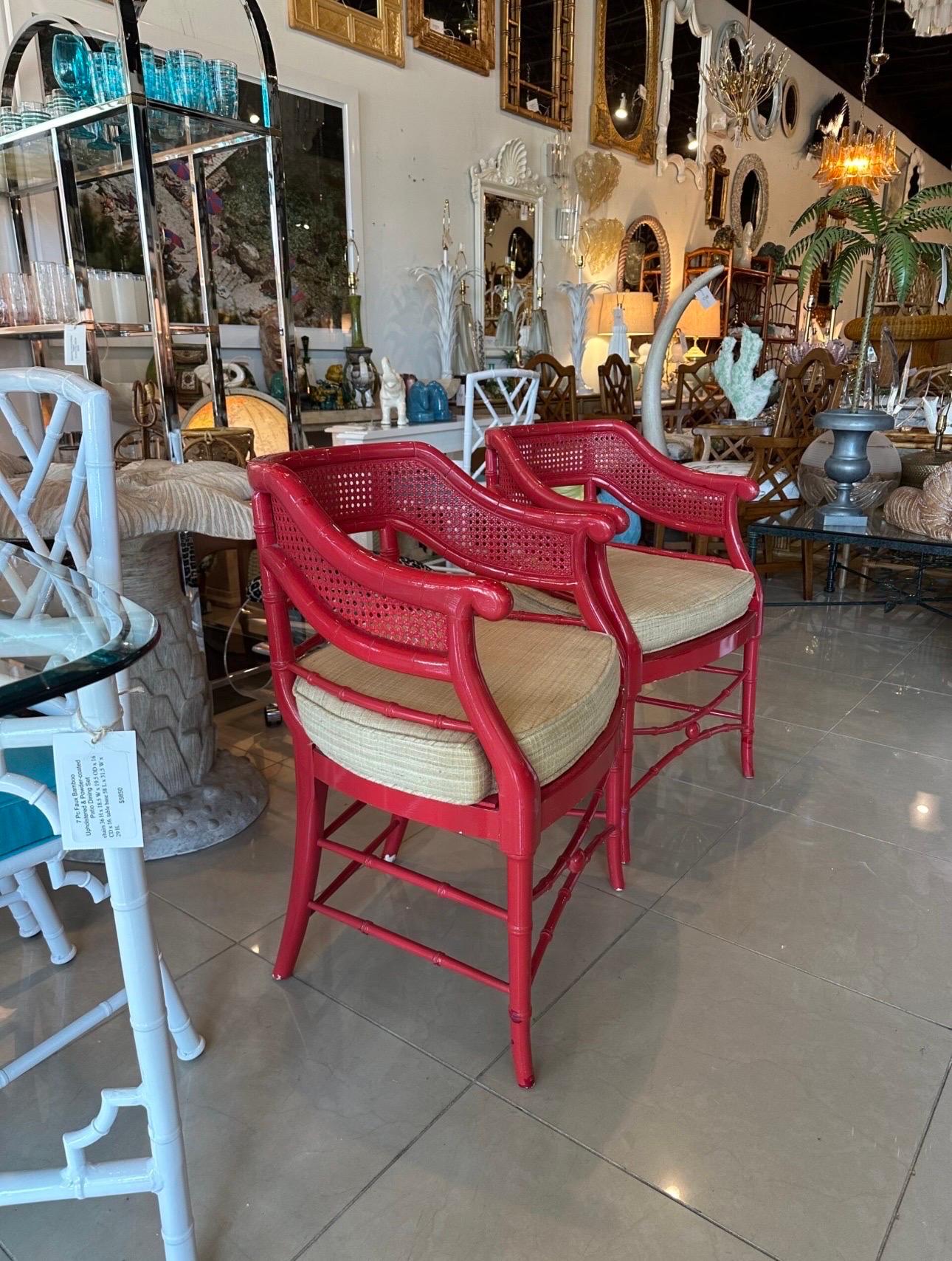 Lovely pair of vintage faux bamboo & cane occasional barrel arm chairs by Baker. The details on these are fantastic! These are being sold as is. The lacquer is original and has chips and touch ups. Will need new lacquer or paint. The cushions are