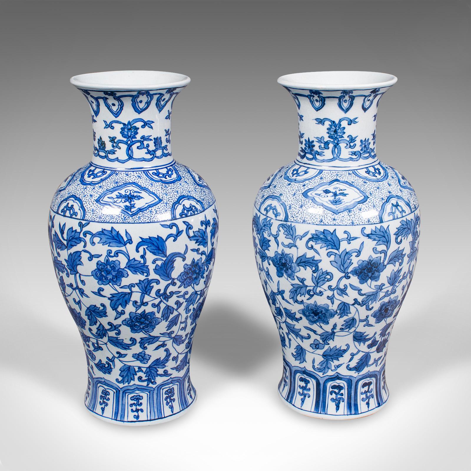 This is a pair of vintage baluster vases. A Chinese, ceramic flower vase with foliate decor, dating to the late Art Deco period, circa 1940.

Delightfully decorative vases, ideal for a side table or mantlepiece display
Displaying a desirable aged