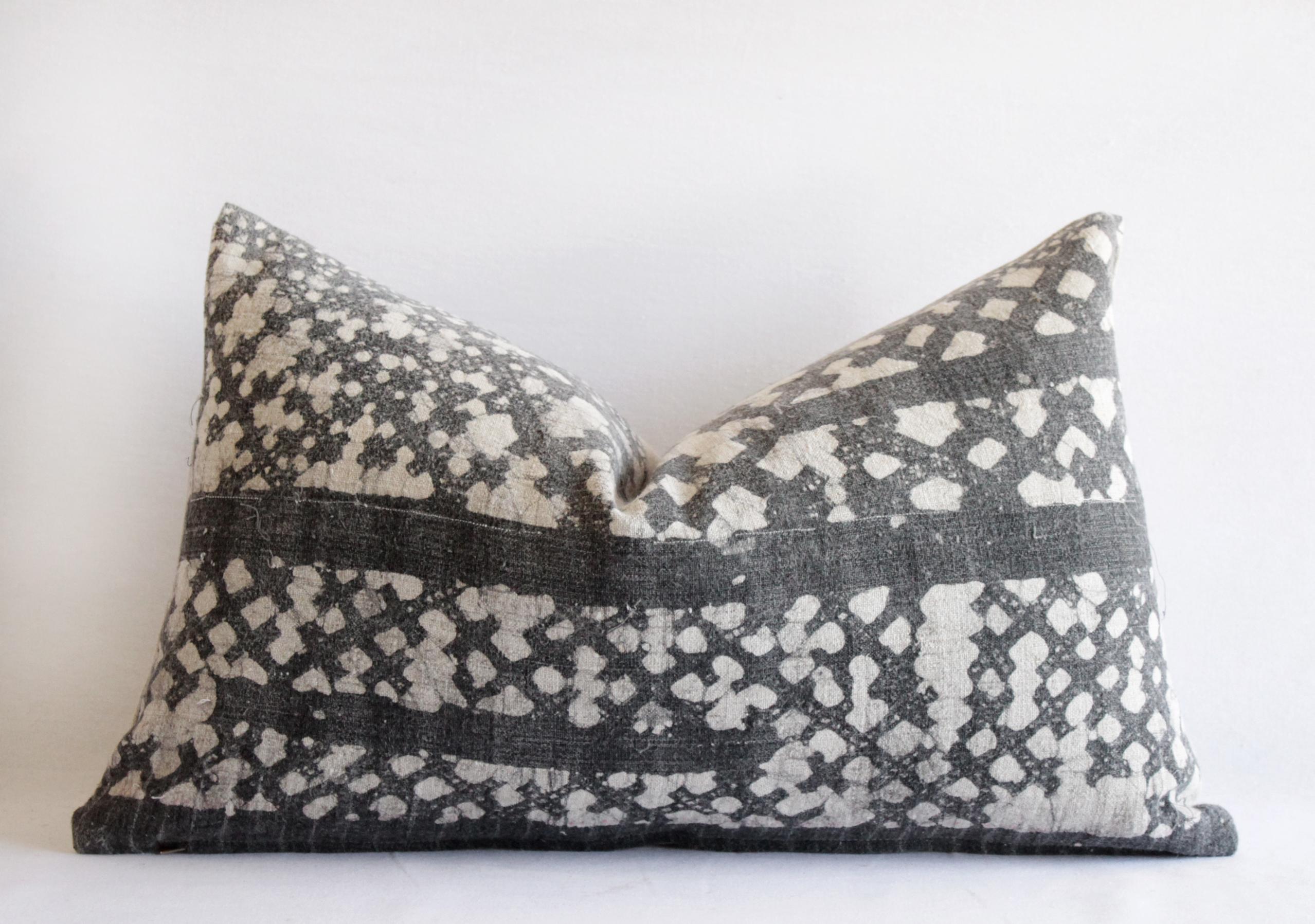 Vintage batik accent pillow charcoal and natural linen
This is a beautiful vintage textile piece we have created into a pair of pillows. The front side is a linen weave, light natural color background with a darker charcoal grey (faded black) batik