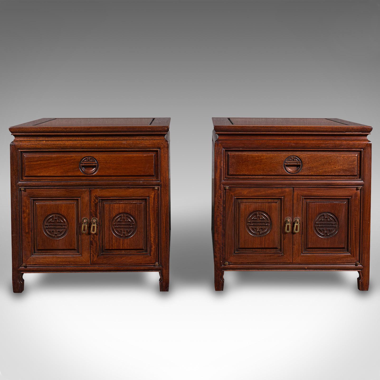 This is a pair of vintage bedside nightstands. An Asian, rosewood low side cabinet, dating to the late Art Deco period, circa 1940.

Pleasingly square in proportion and of appealing quality
Displays a desirable aged patina and in good