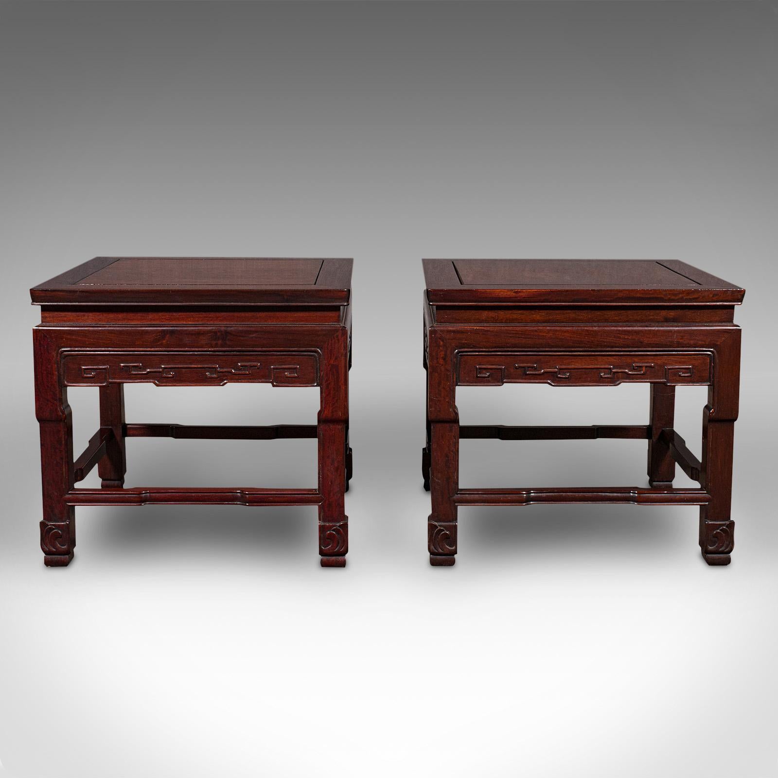 This is a pair of vintage bedside tables. An Oriental, mahogany small side, or coffee table, dating to the late Art Deco period, circa 1940.

Delightful Oriental taste and superb colour to this versatile pair of tables
Displaying a desirable aged