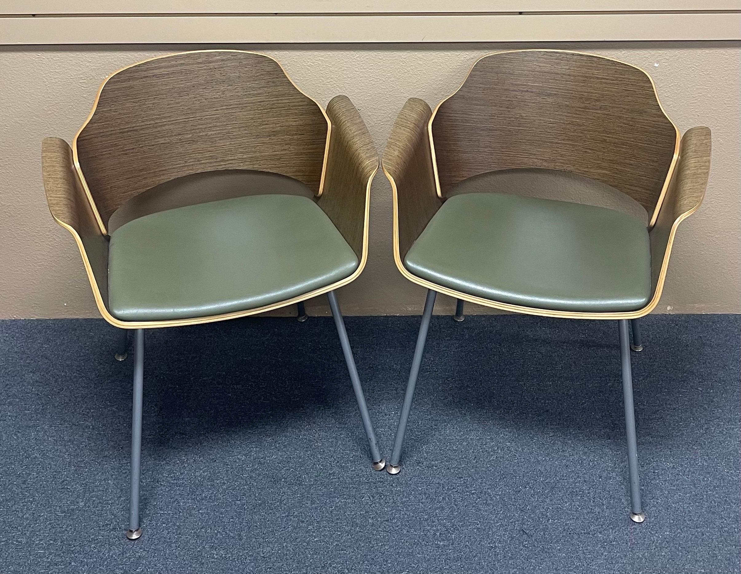 Pair of vintage bent wood lounge chairs with walnut veneer frame, avocado vinyl upholstery and chrome legs by Stylex, circa 1980s. The pair are in very good vintage condition and measure 26.75
