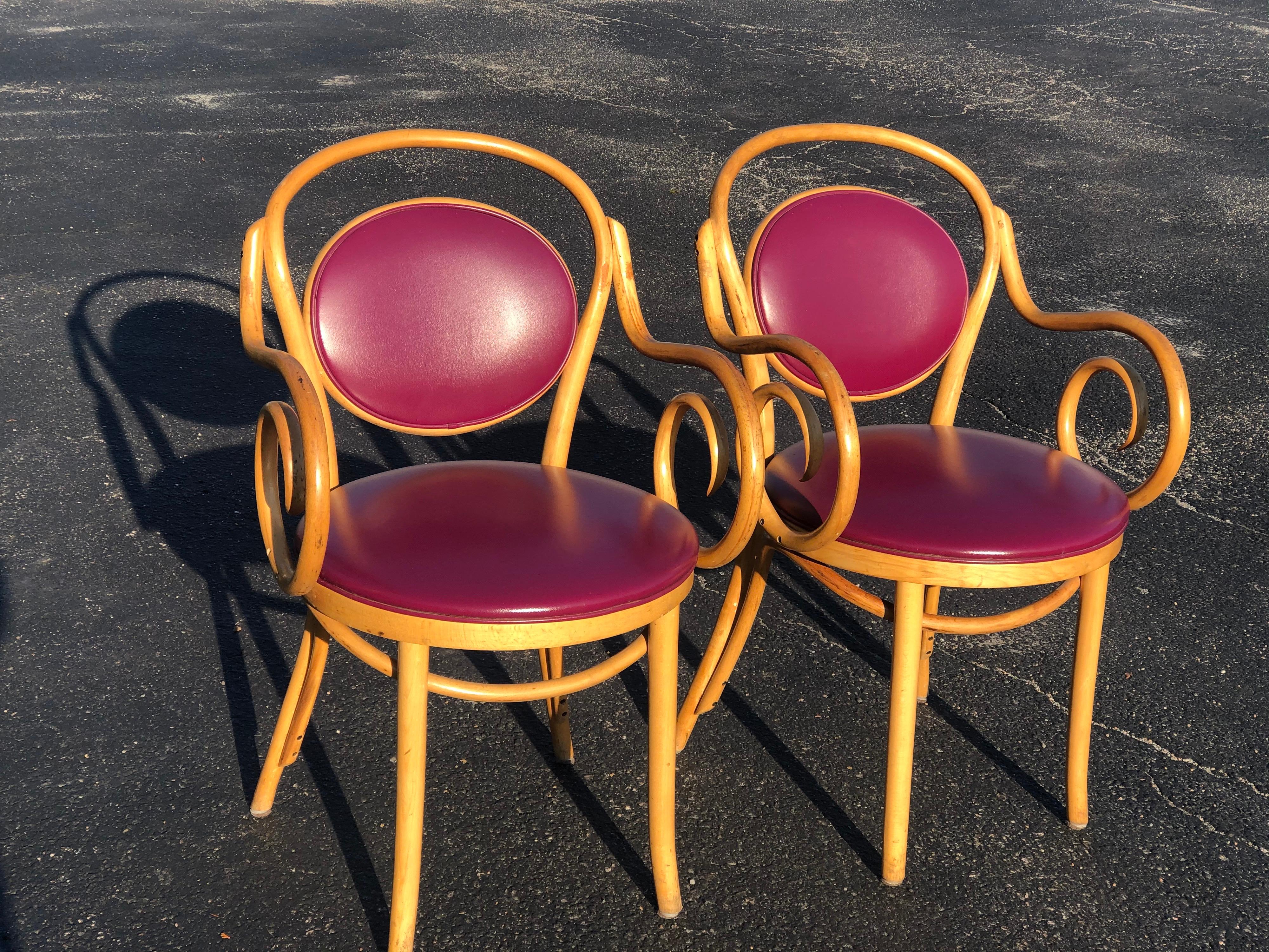 Pair of vintage bentwood Thonet style chairs in Violet. Price is for 2 chairs.
Classic timeless design. This amazing color is very rare. The pair is signed underneath made in Romania where Thonet had factories. The seat upholstery is a vinyl. Price