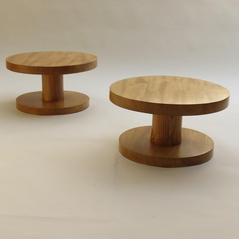 Wonderful pair of handmade bespoke side tables, made from solid elm. These have been hand produced, turning the wood on a lathe. The wood has cracked as it has dried over time adding to the wonderful character of these tables. Dates from the